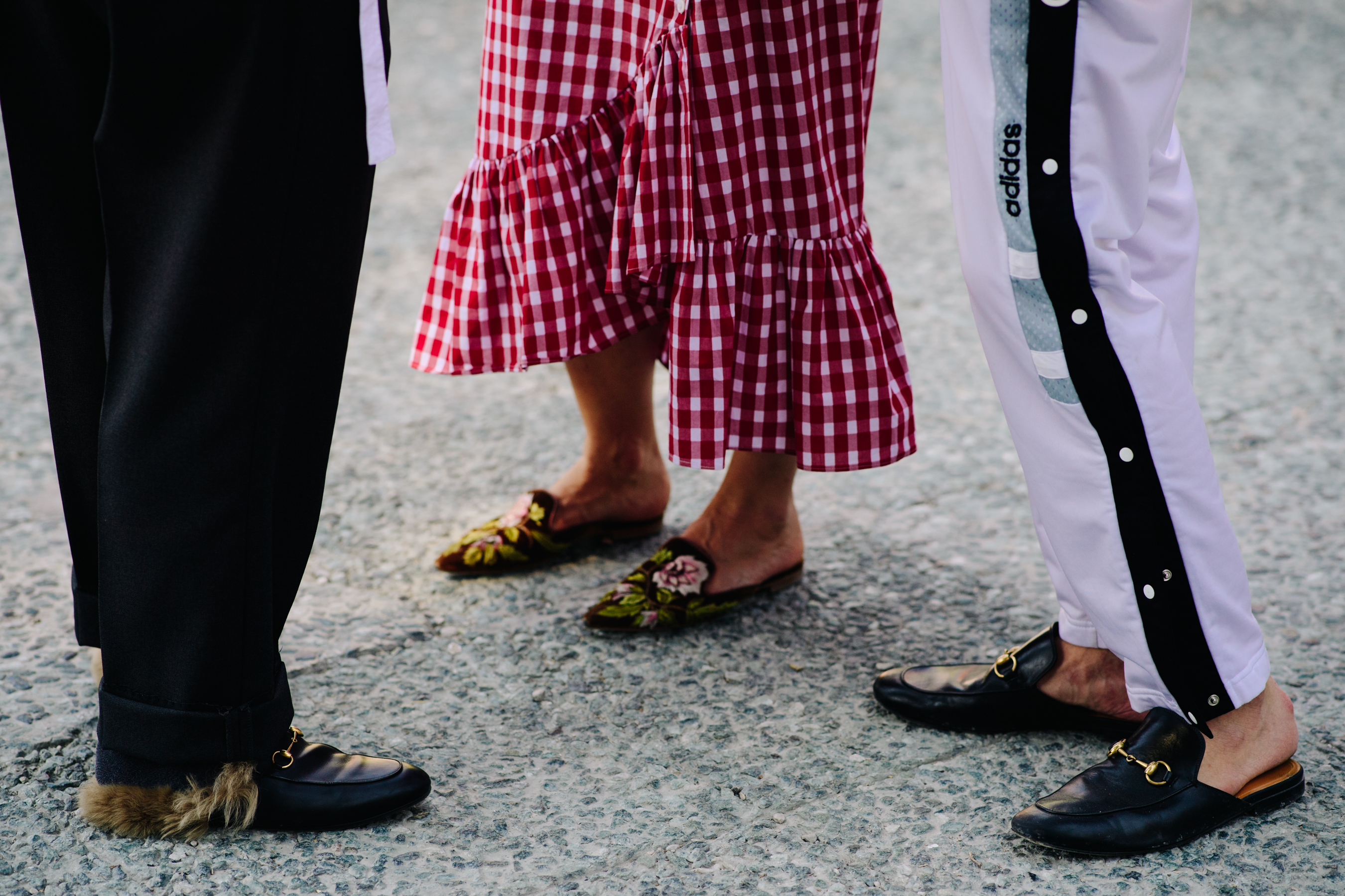 Group of people wearing Gucci slippers