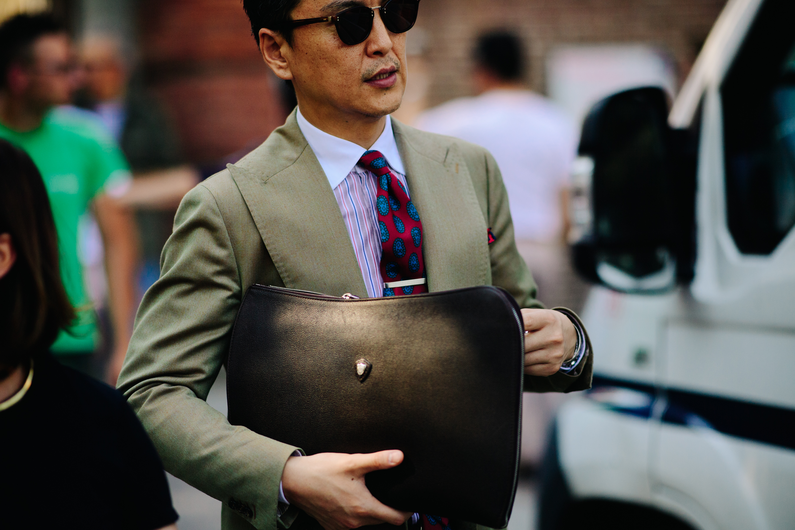 Man wearing beige blazer and tie