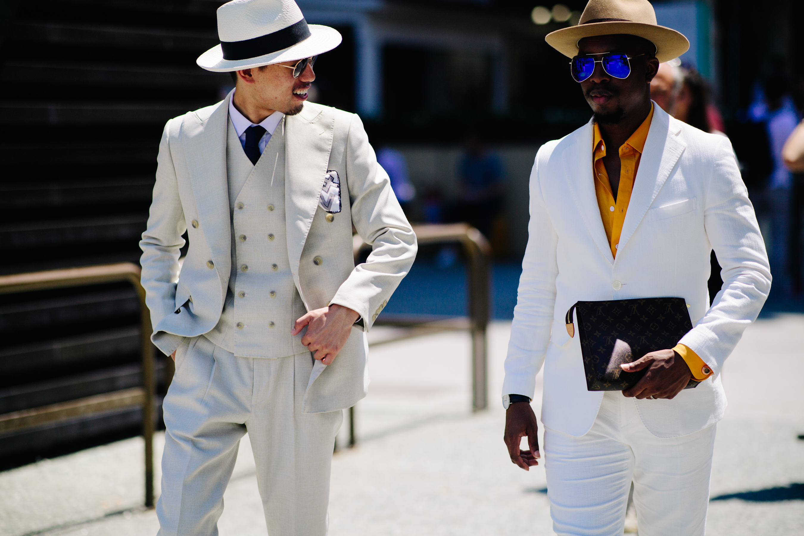 Two men wearing white suits