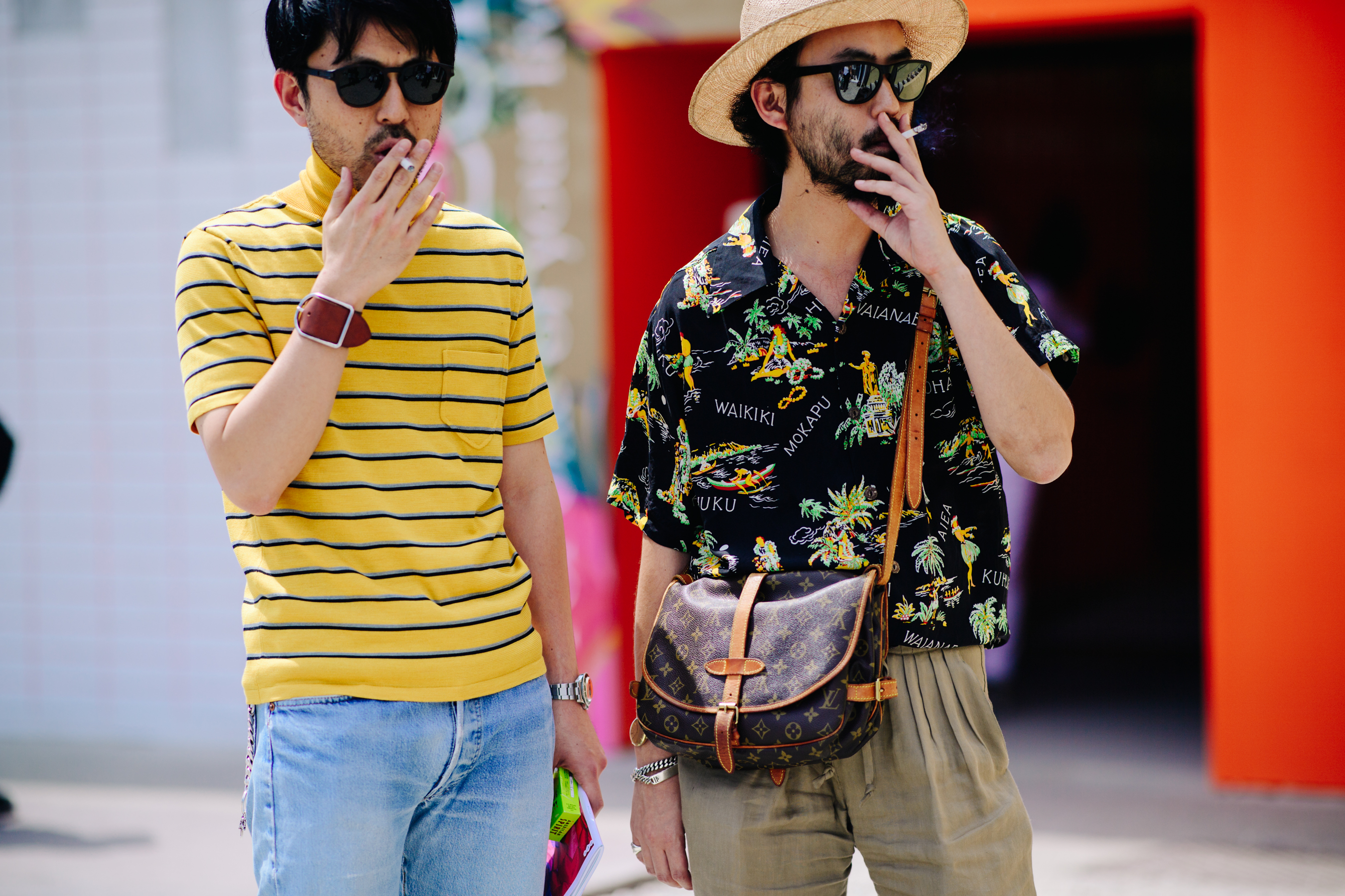 Guy carrying a Louis Vuitton bag