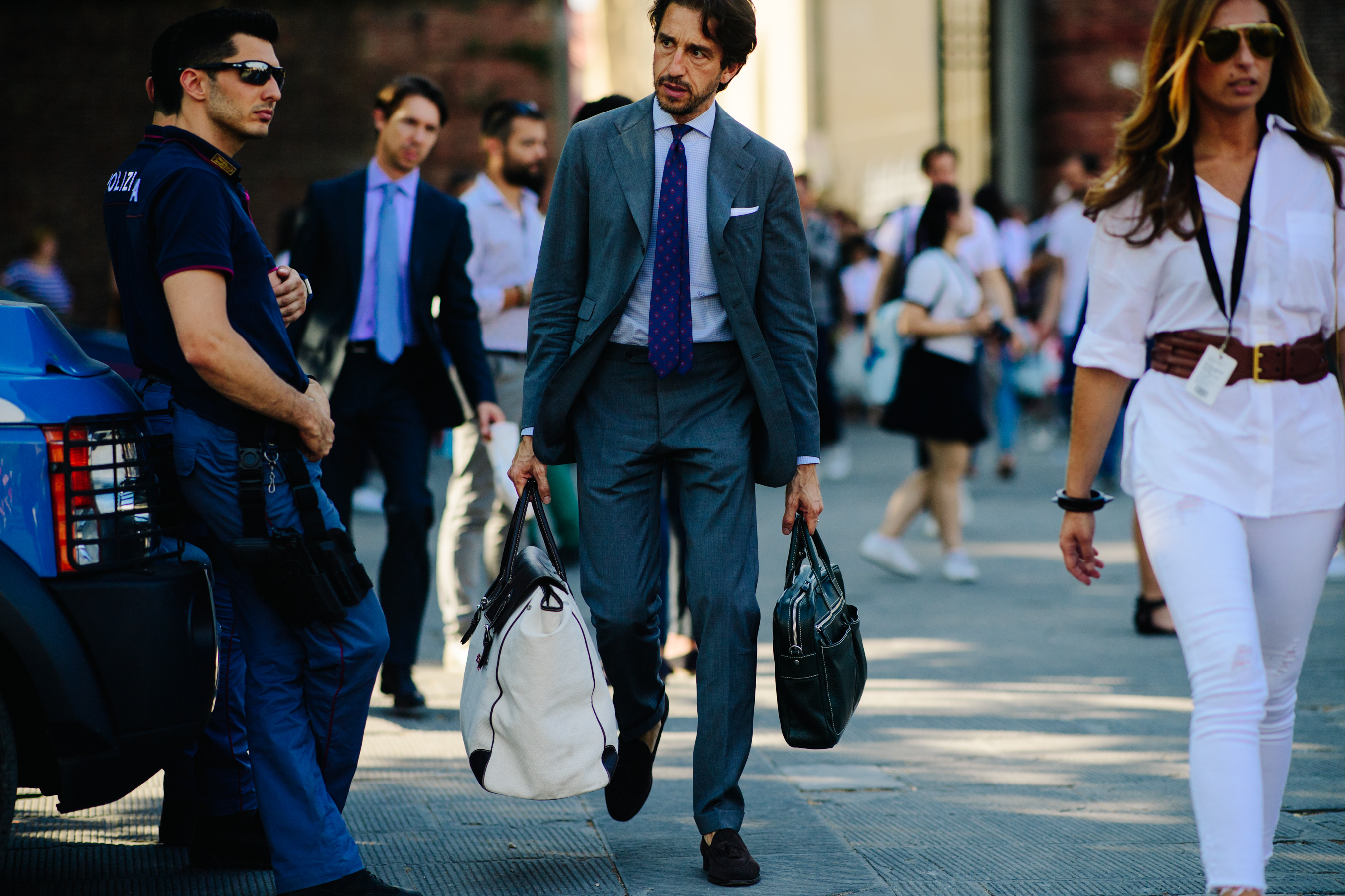 Man carrying a large white bag