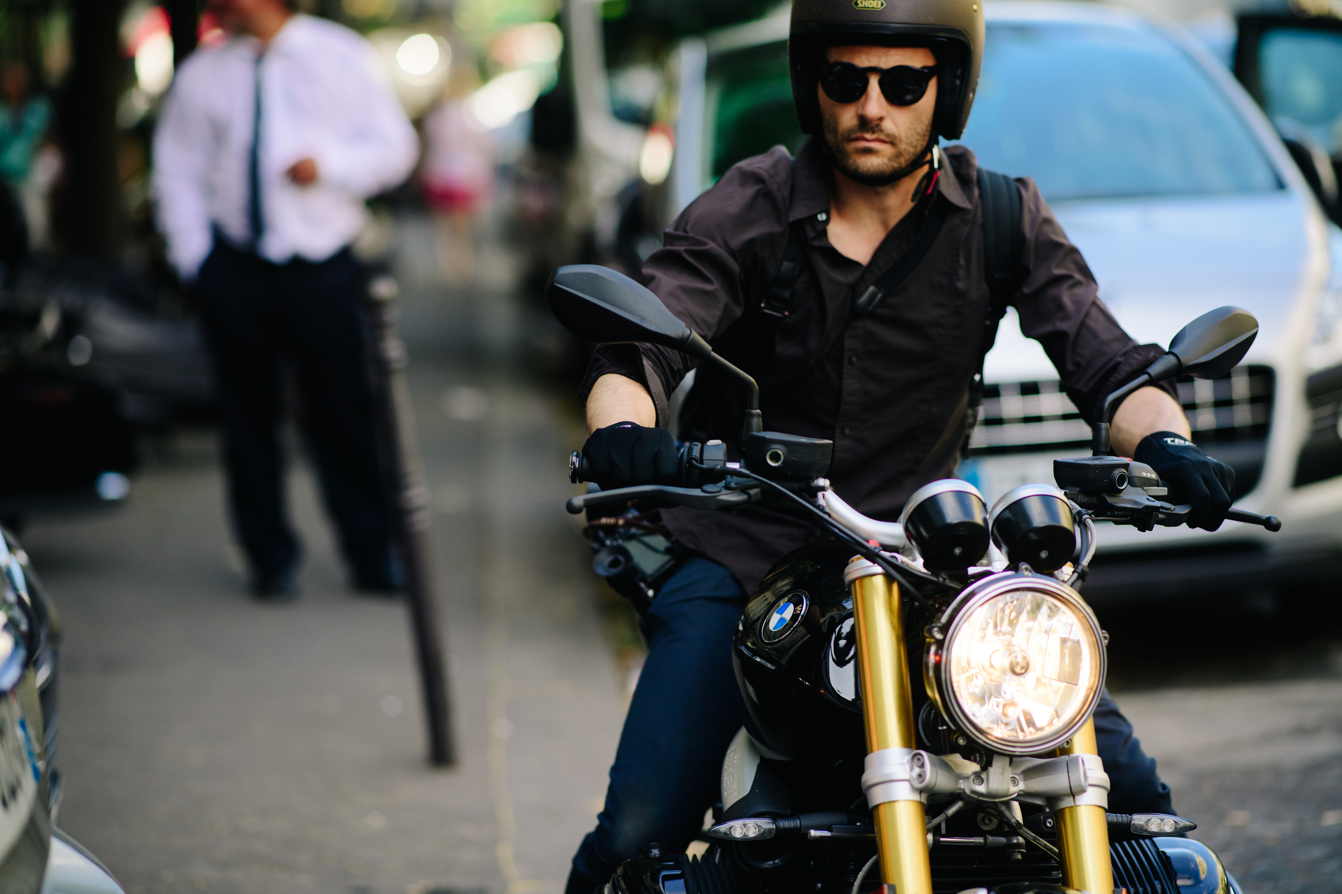Man riding a BMW motorcycle