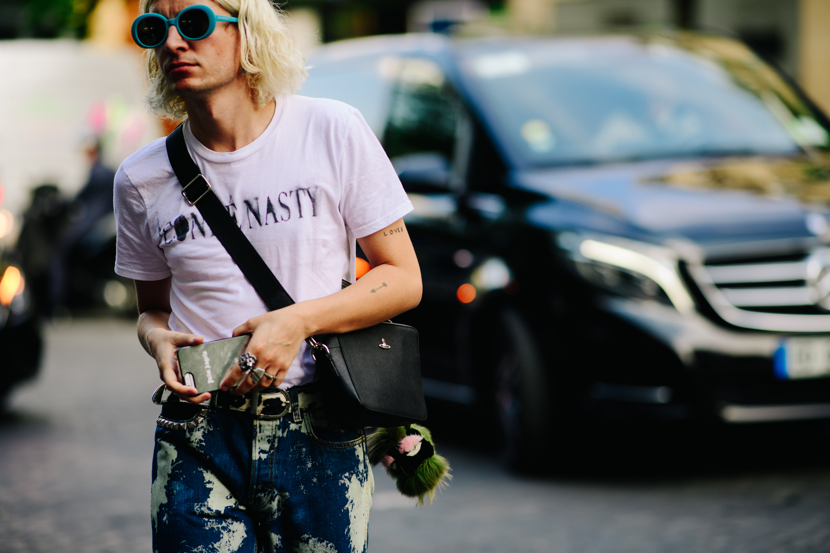 Stylist carrying a Vivienne Westwood bag