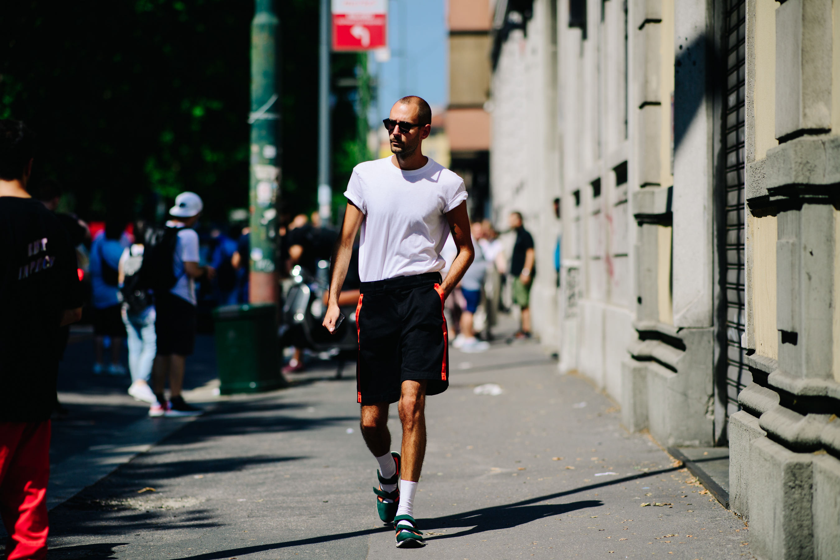 Man wearing black striped shorts