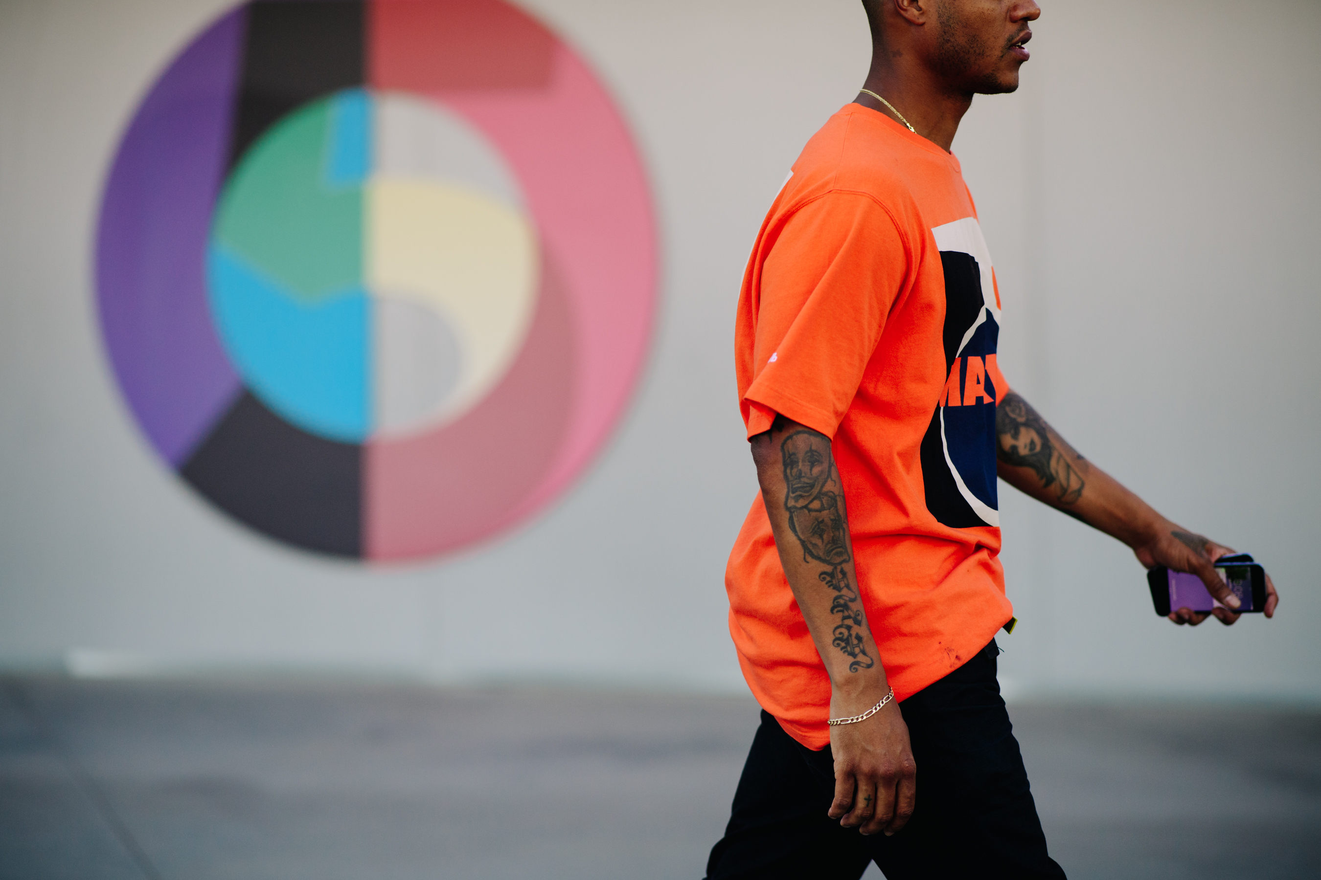 Fashion designer wearing several tattoos