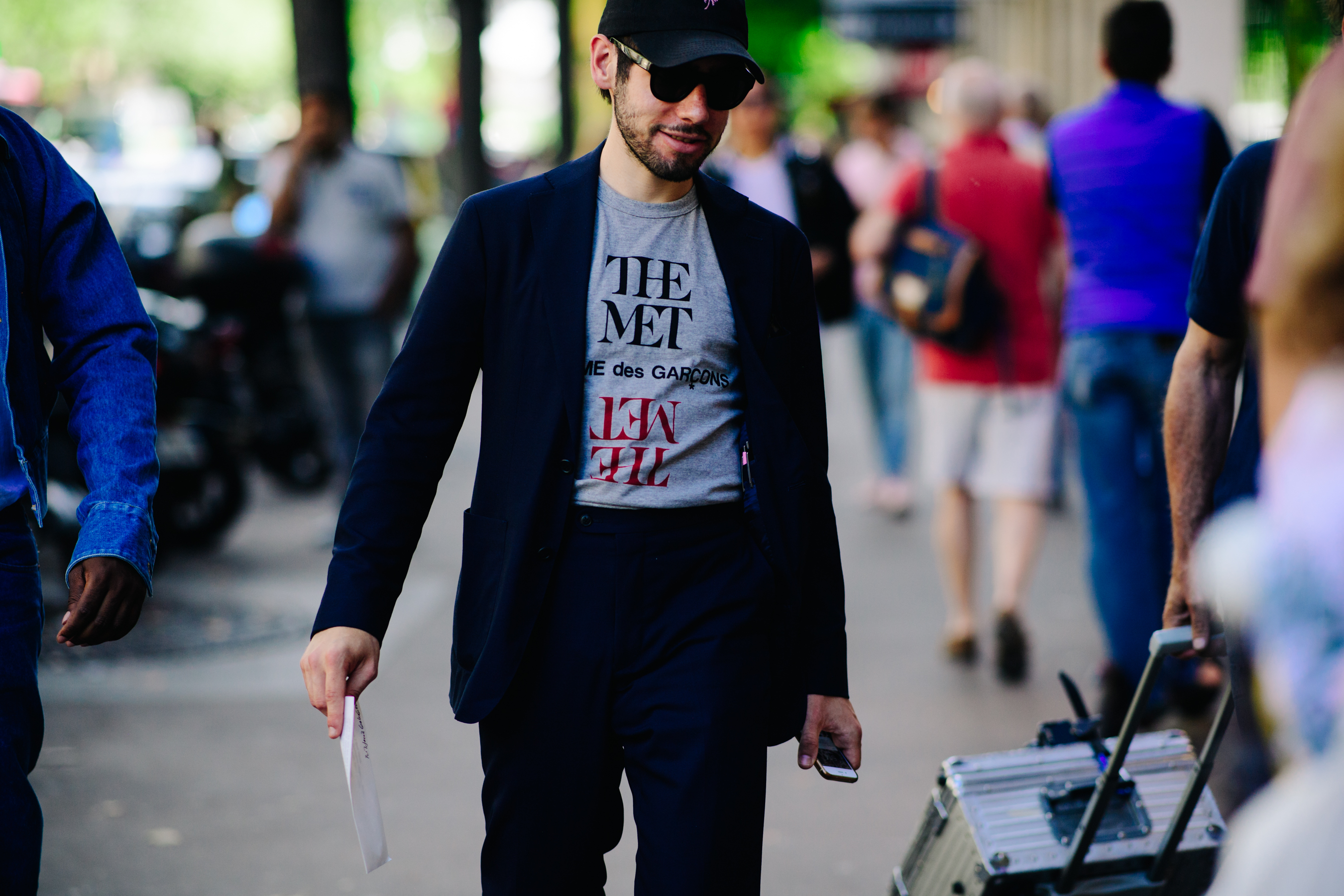 Man wearing a Comme des Garçons t-shirt