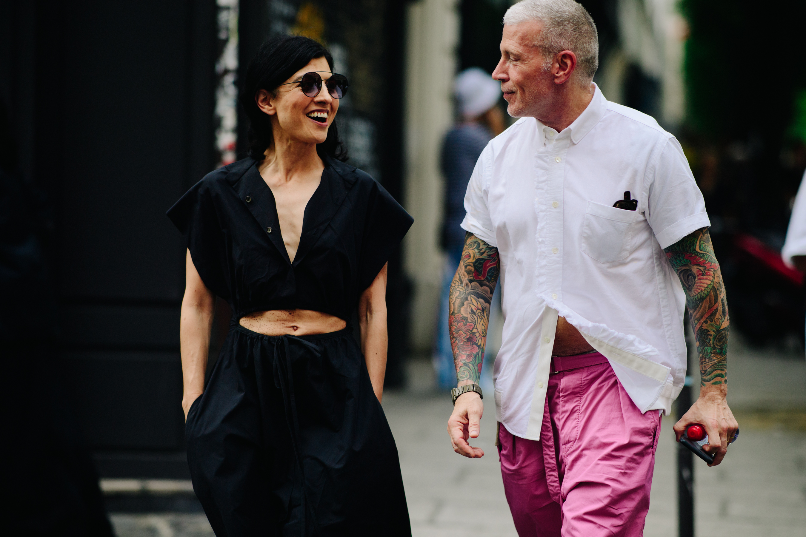Woman and man wearing contrasting outfits
