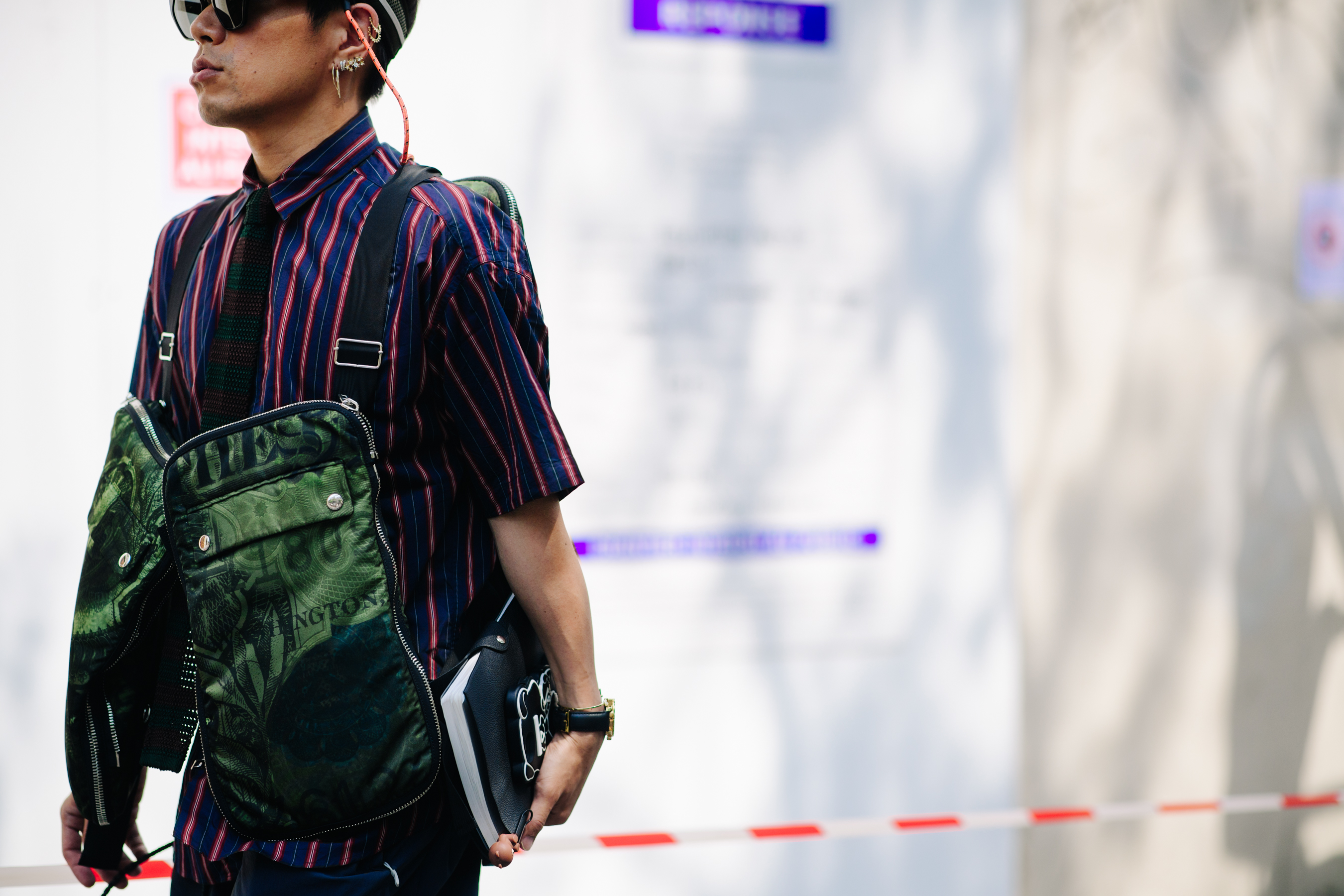 Japanese man wearing a striped shirt