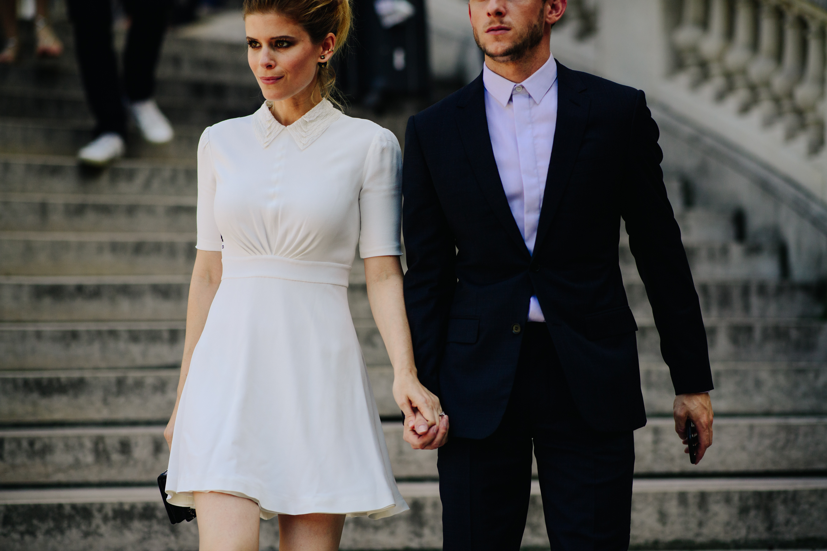 Woman and man wearing classic outfits