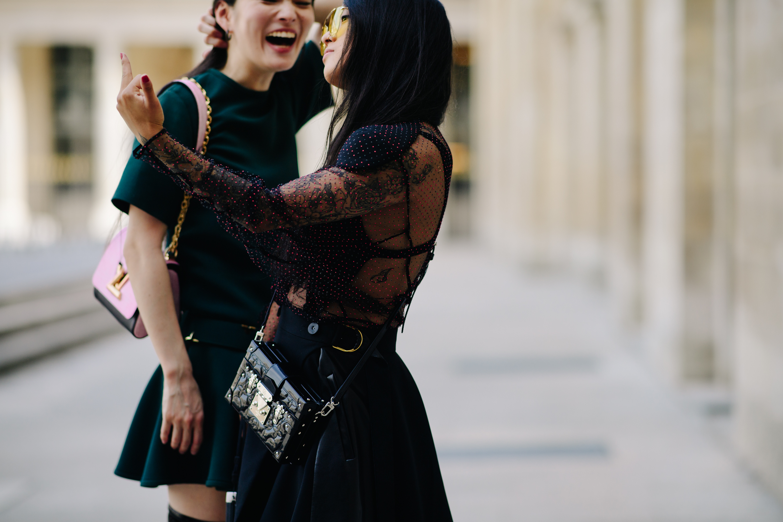 Woman carrying a Louis Vuitton bag