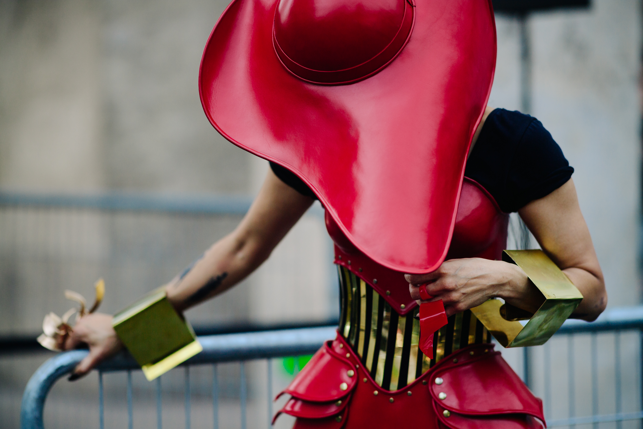 Woman wearing a red leather hat