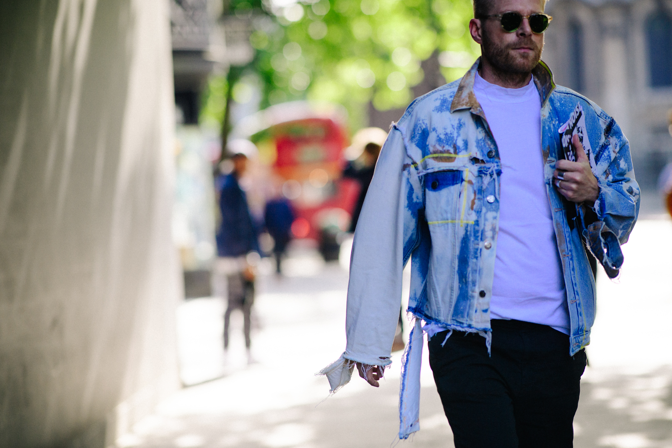 Buyer wearing deconstructed denim jacket