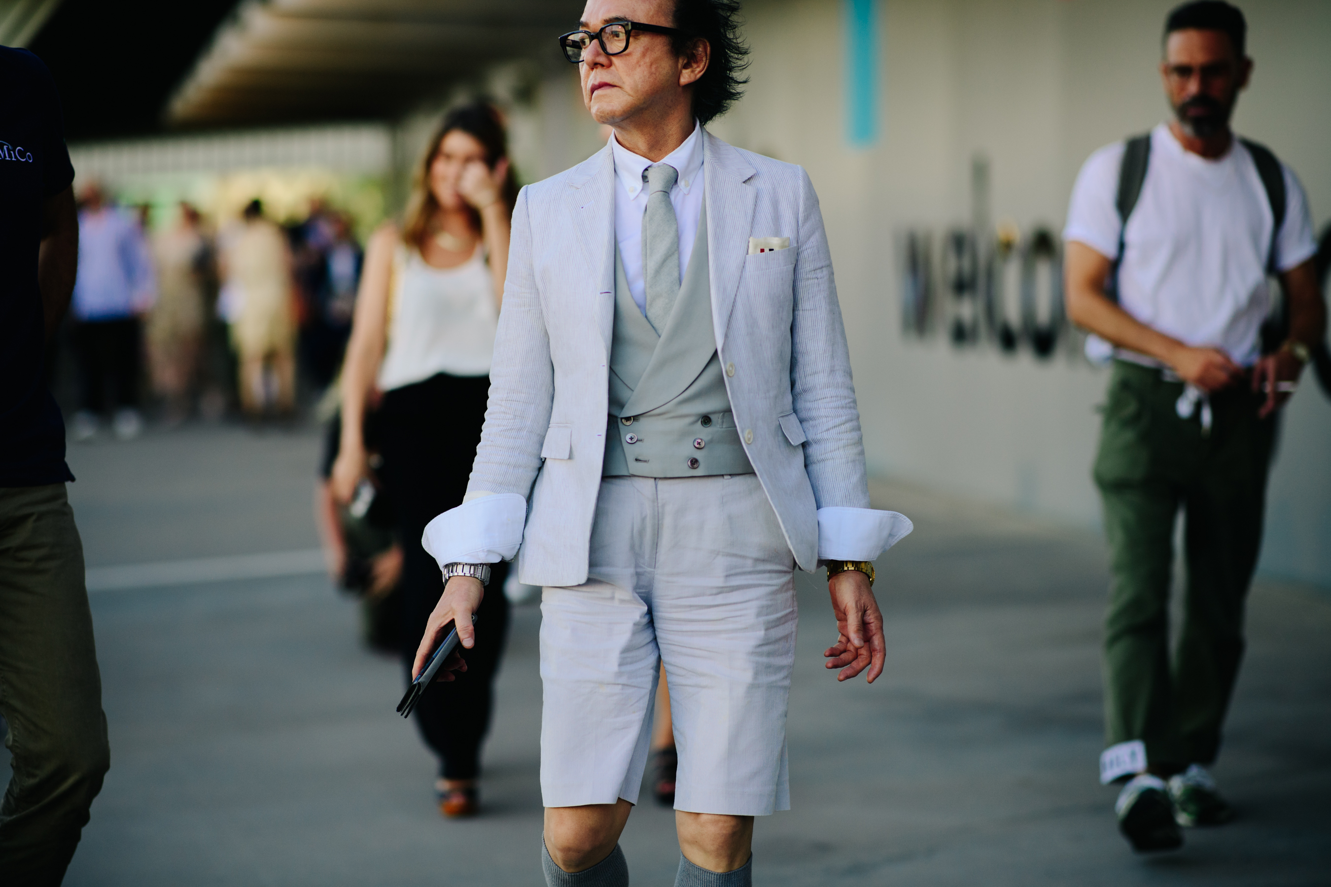 Japanese stylist wearing grey bermudas