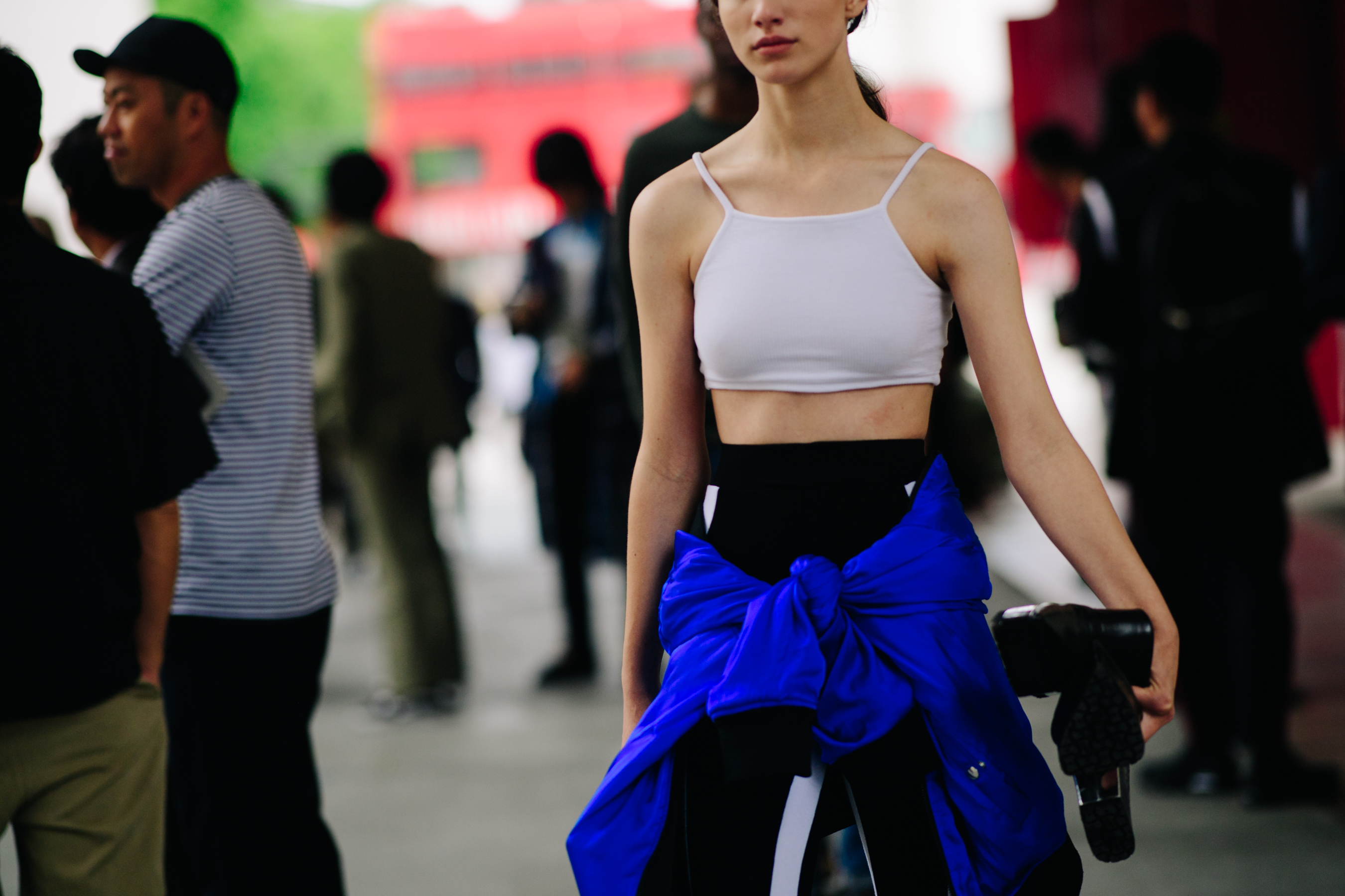 Model wearing a white tank top