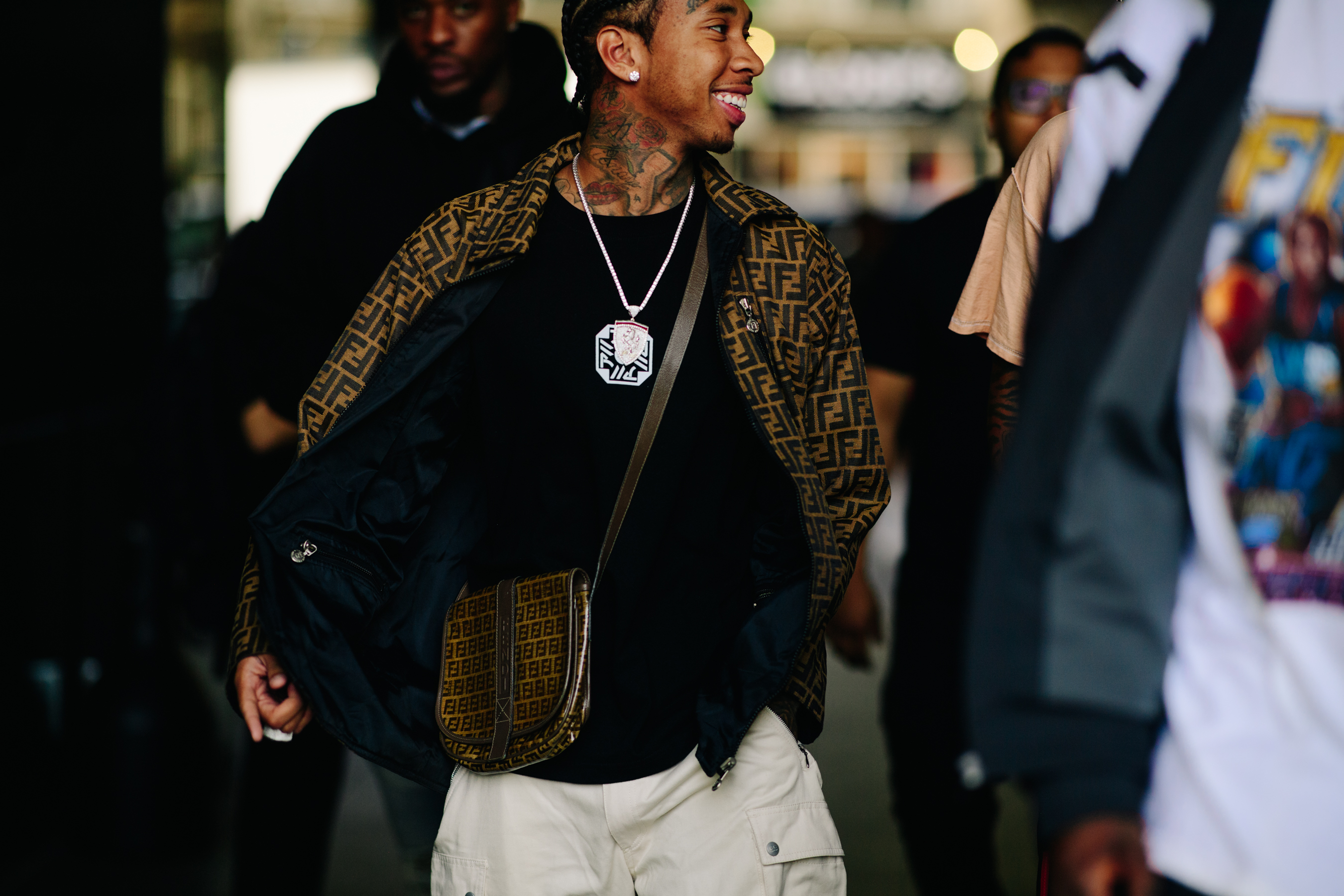 Rapper wearing a Fendi jacket