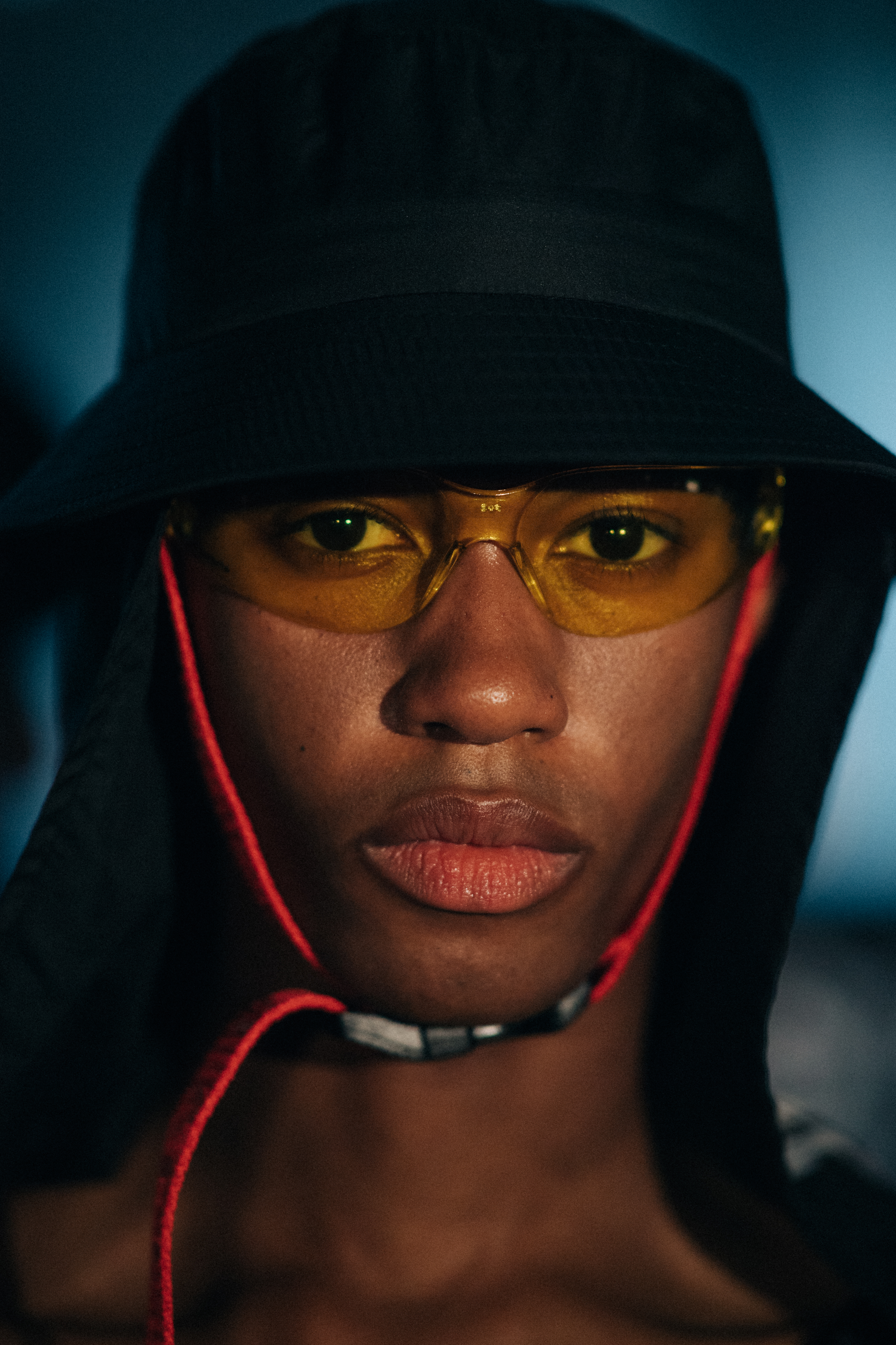 Female model wearing a black hat