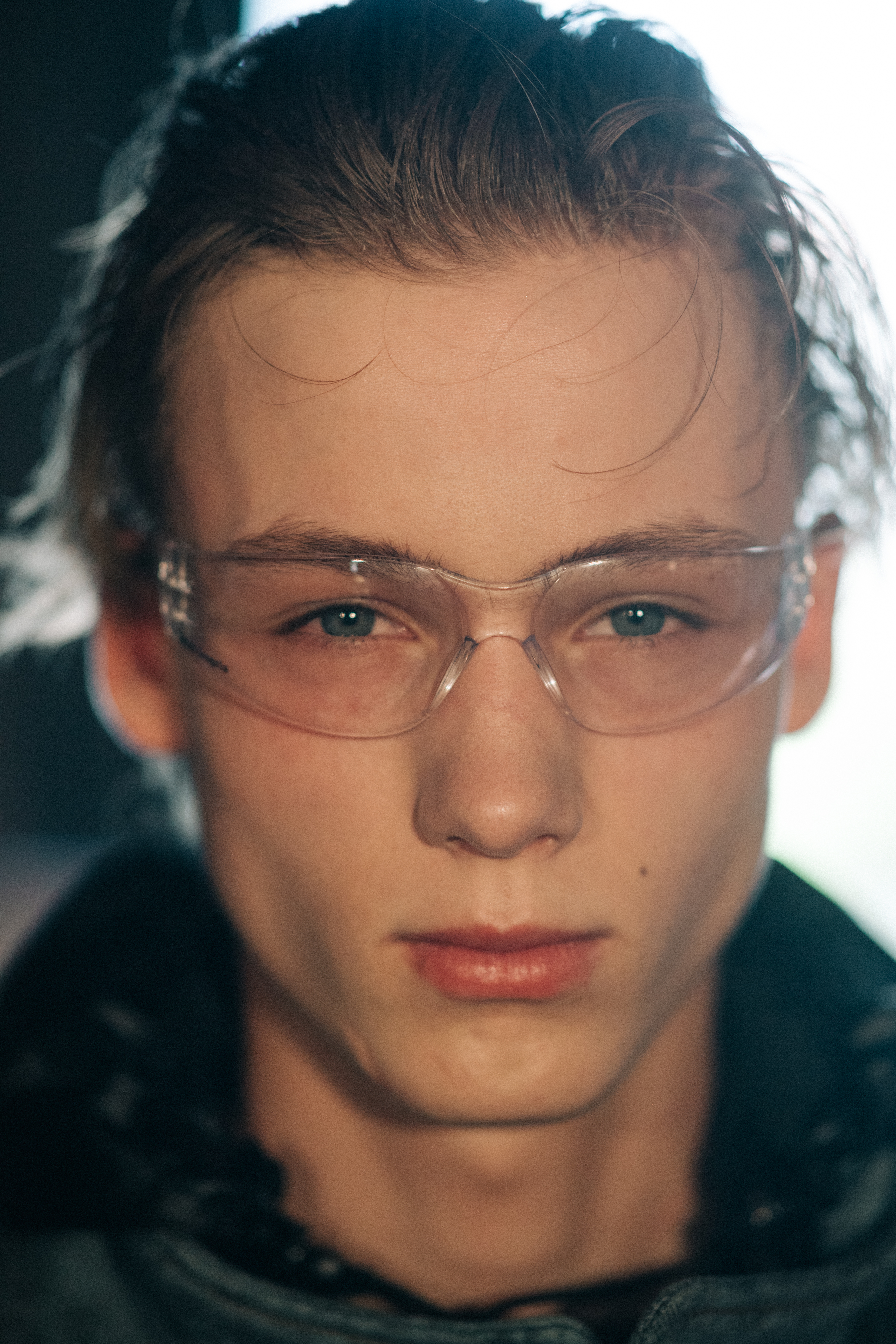 Male model wearing transparent shades