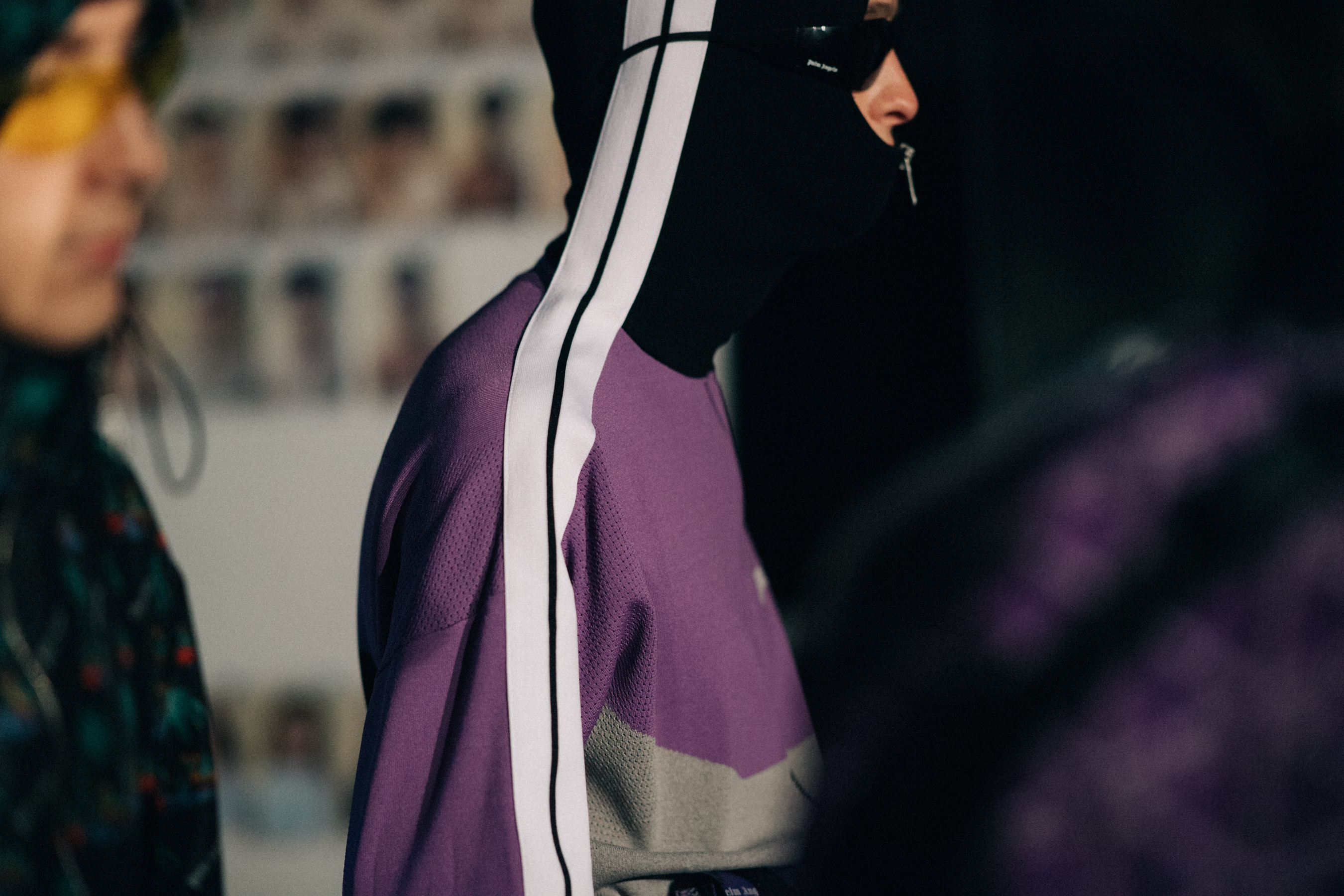 Male model wearing a purple hoodie