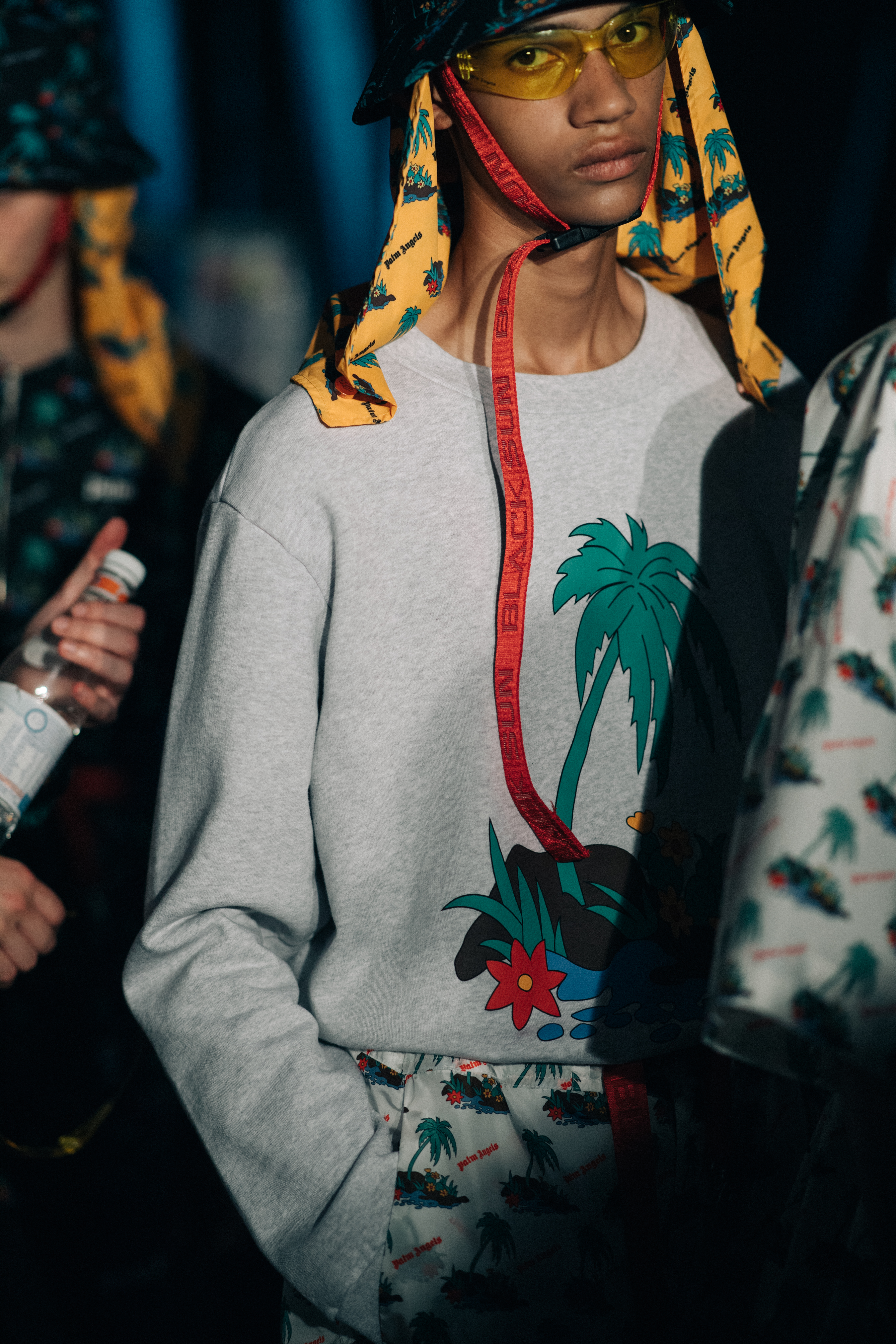 Male model wearing a grey sweatshirt