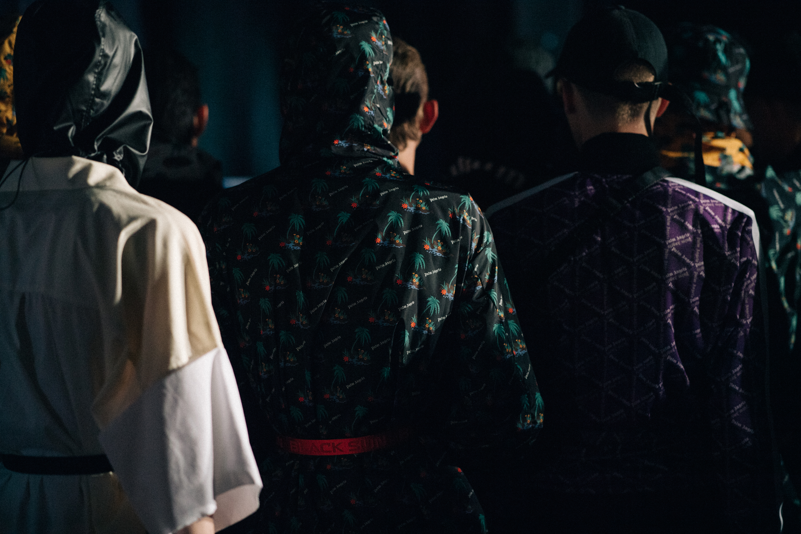 Male models waiting at backstage