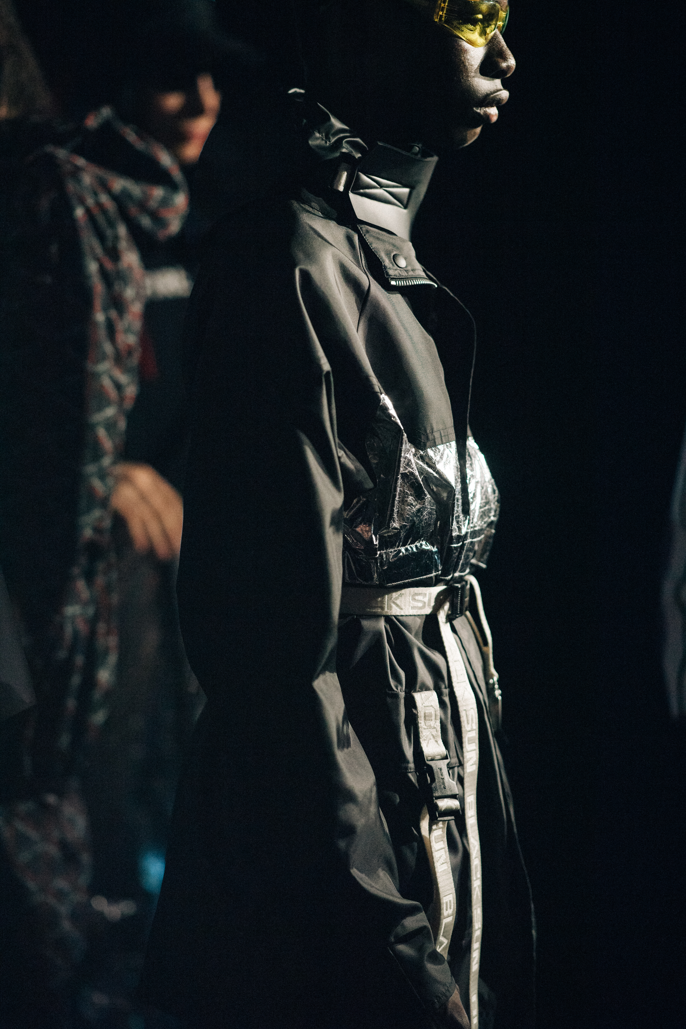 Model wearing a black outfit
