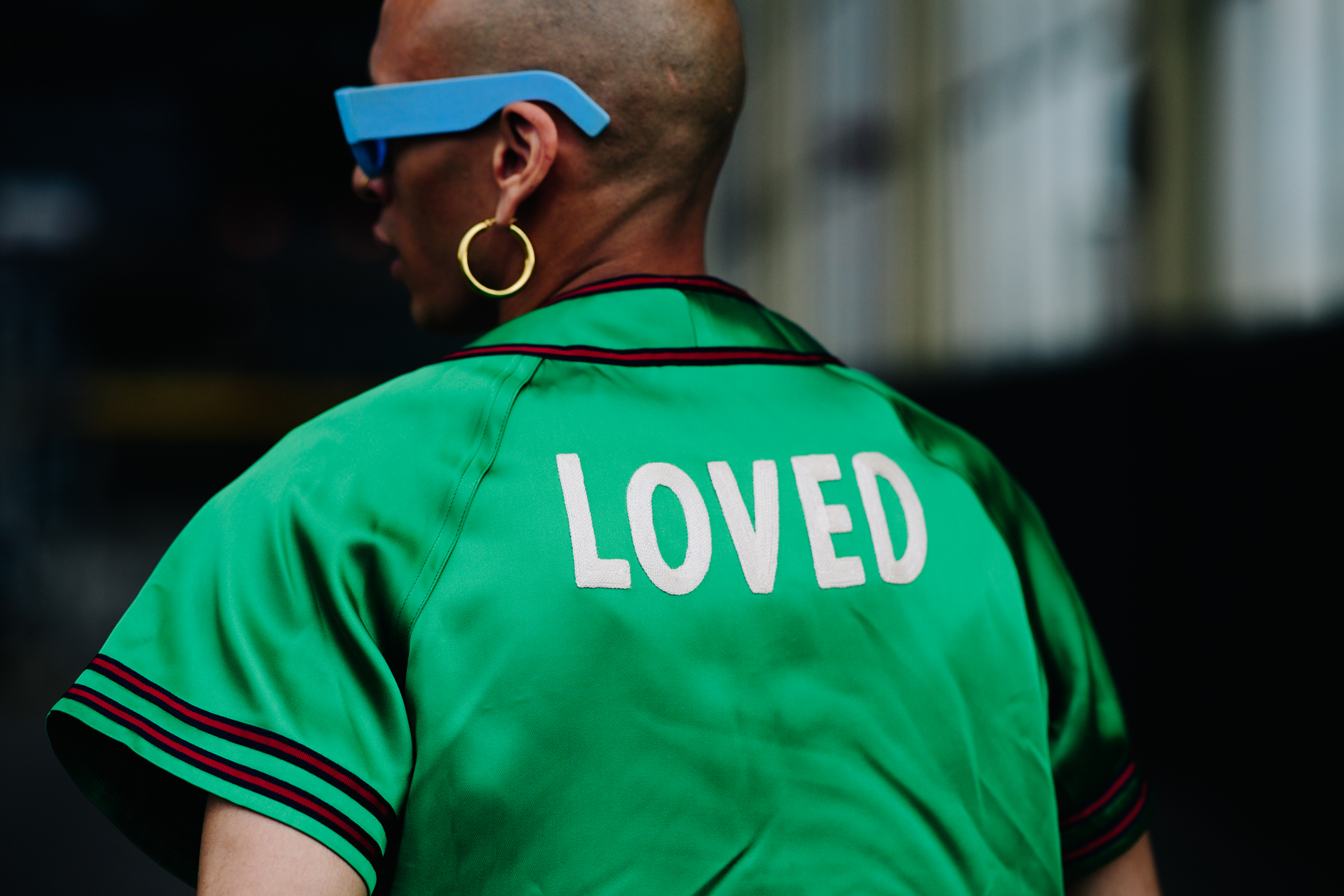 Designer wearing a green shirt