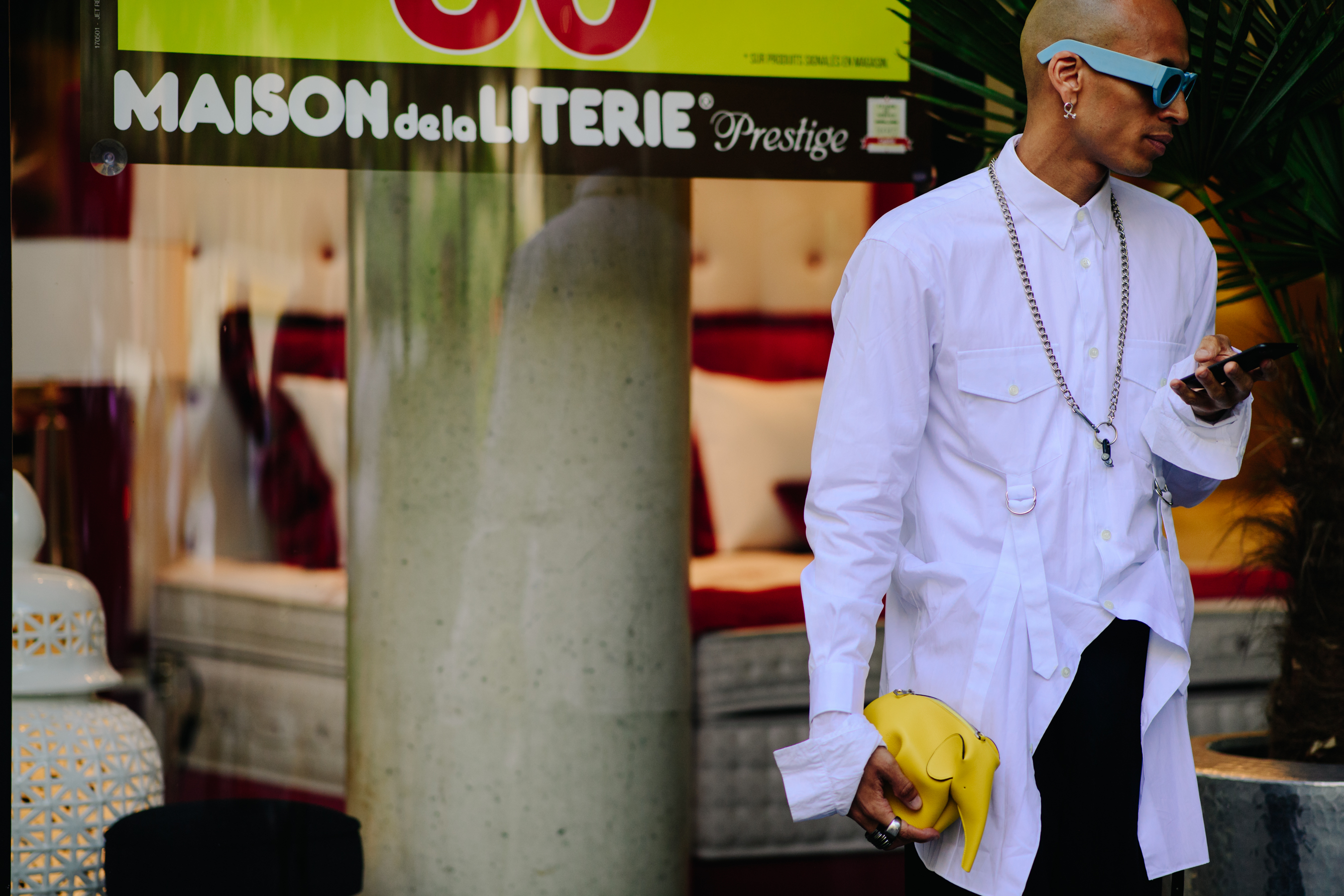 Fashion designer carrying an elephant clutch