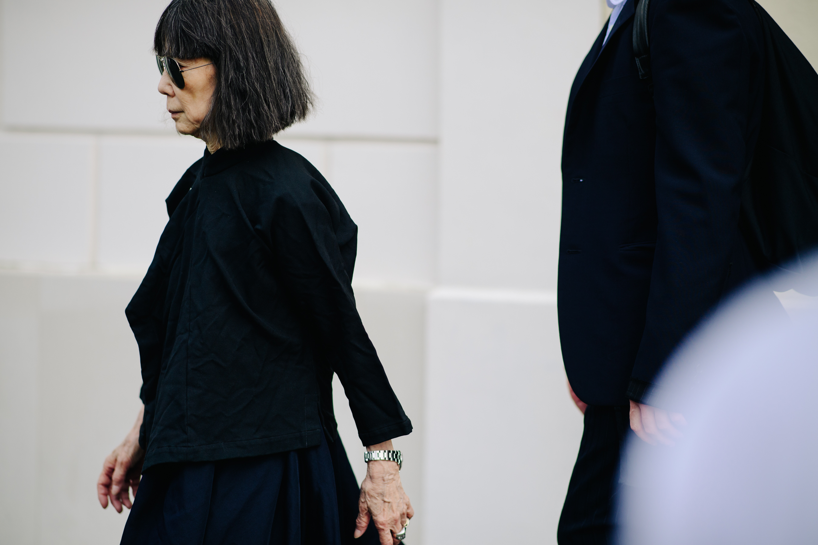 Japanese designer walking after a show