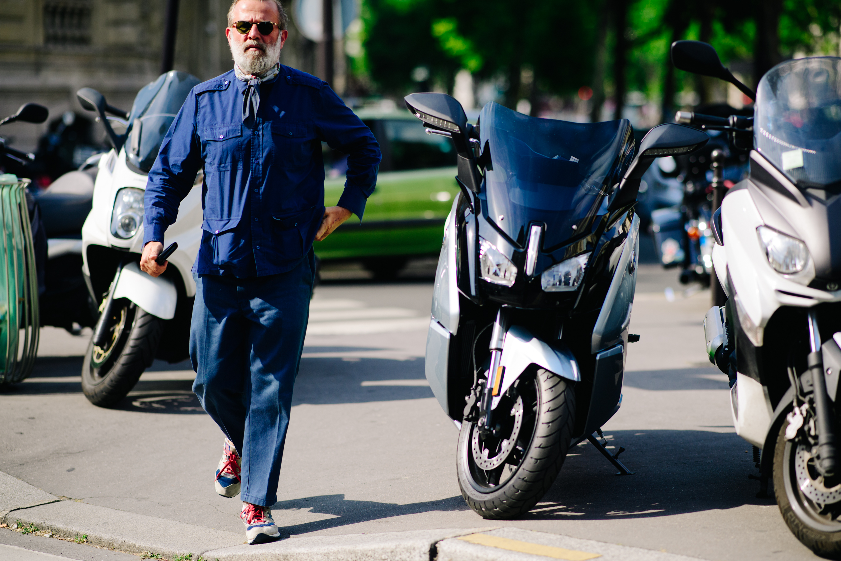 Aged man wearing a dark blue outfit