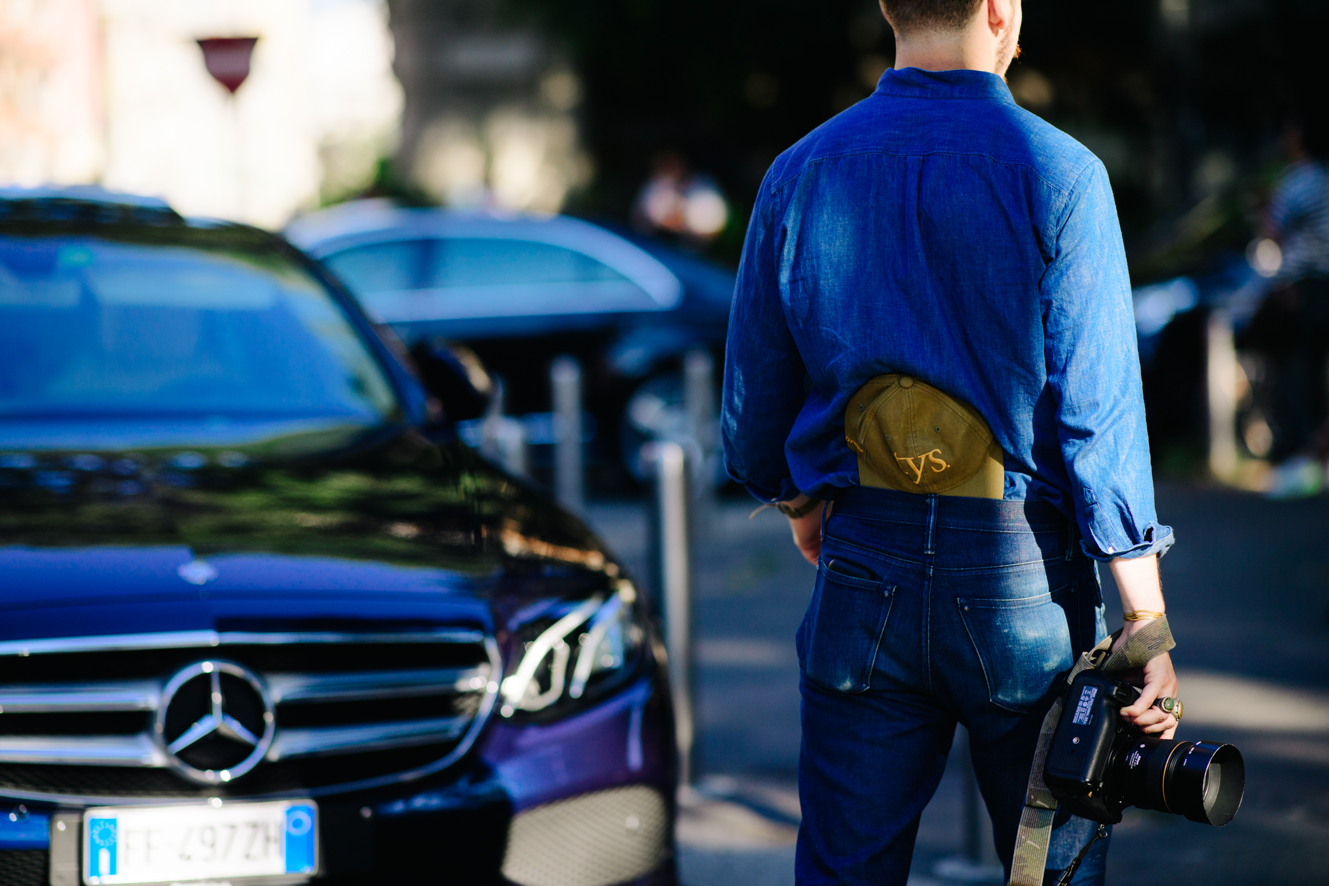 Photographer wearing a denim outfit