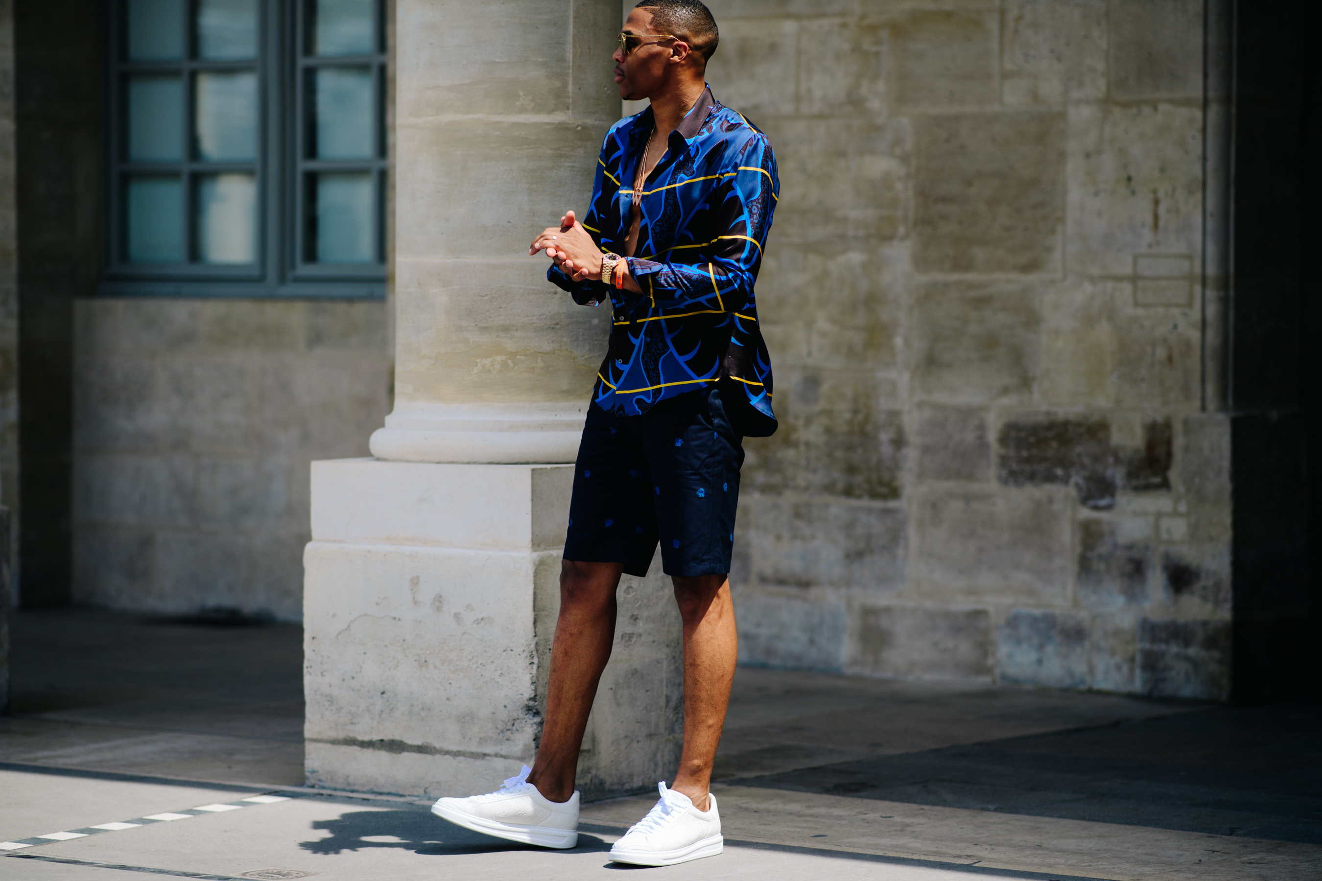 Man wearing satin blue shirt