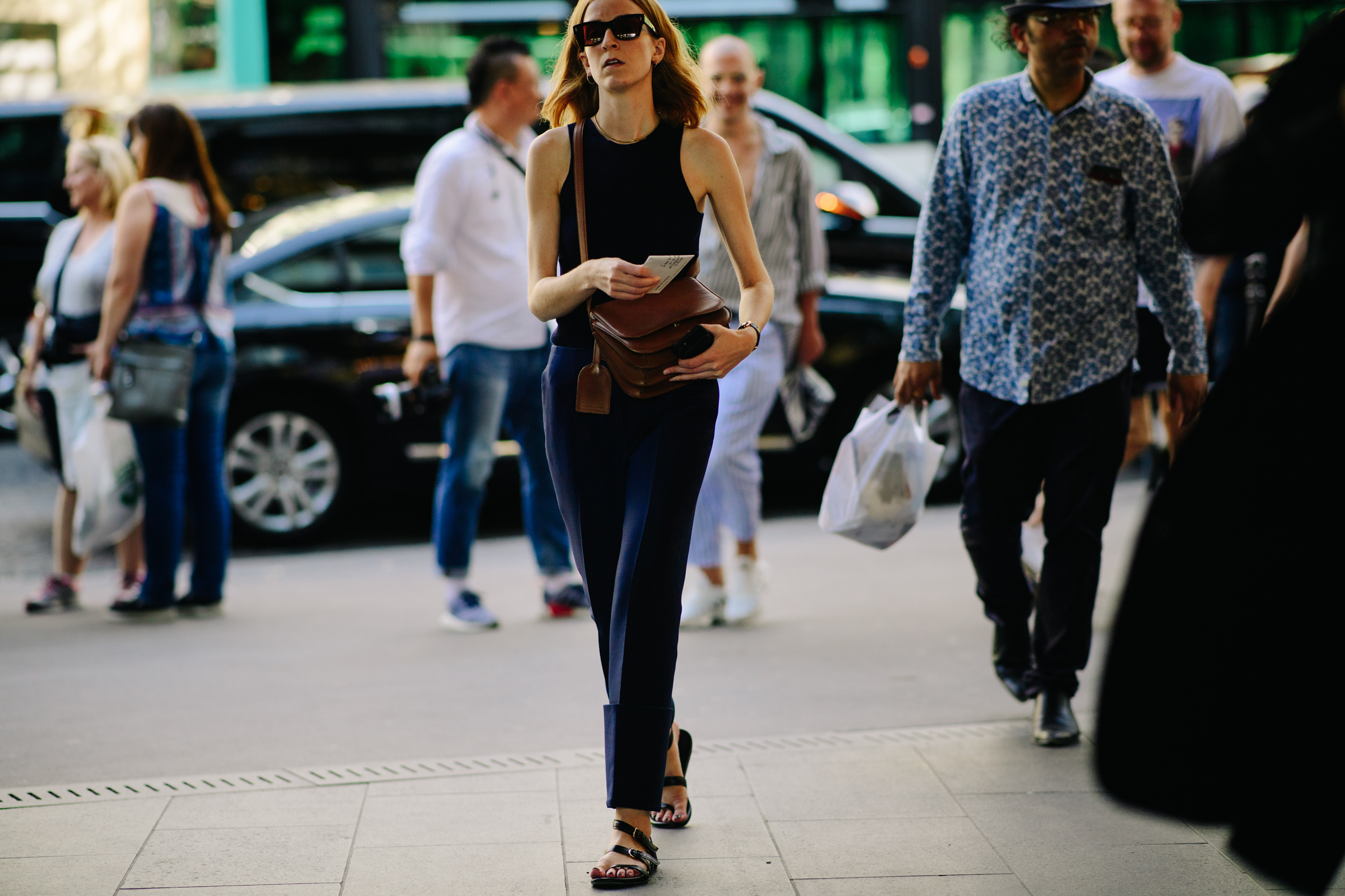 Woman wearing leather black sandals