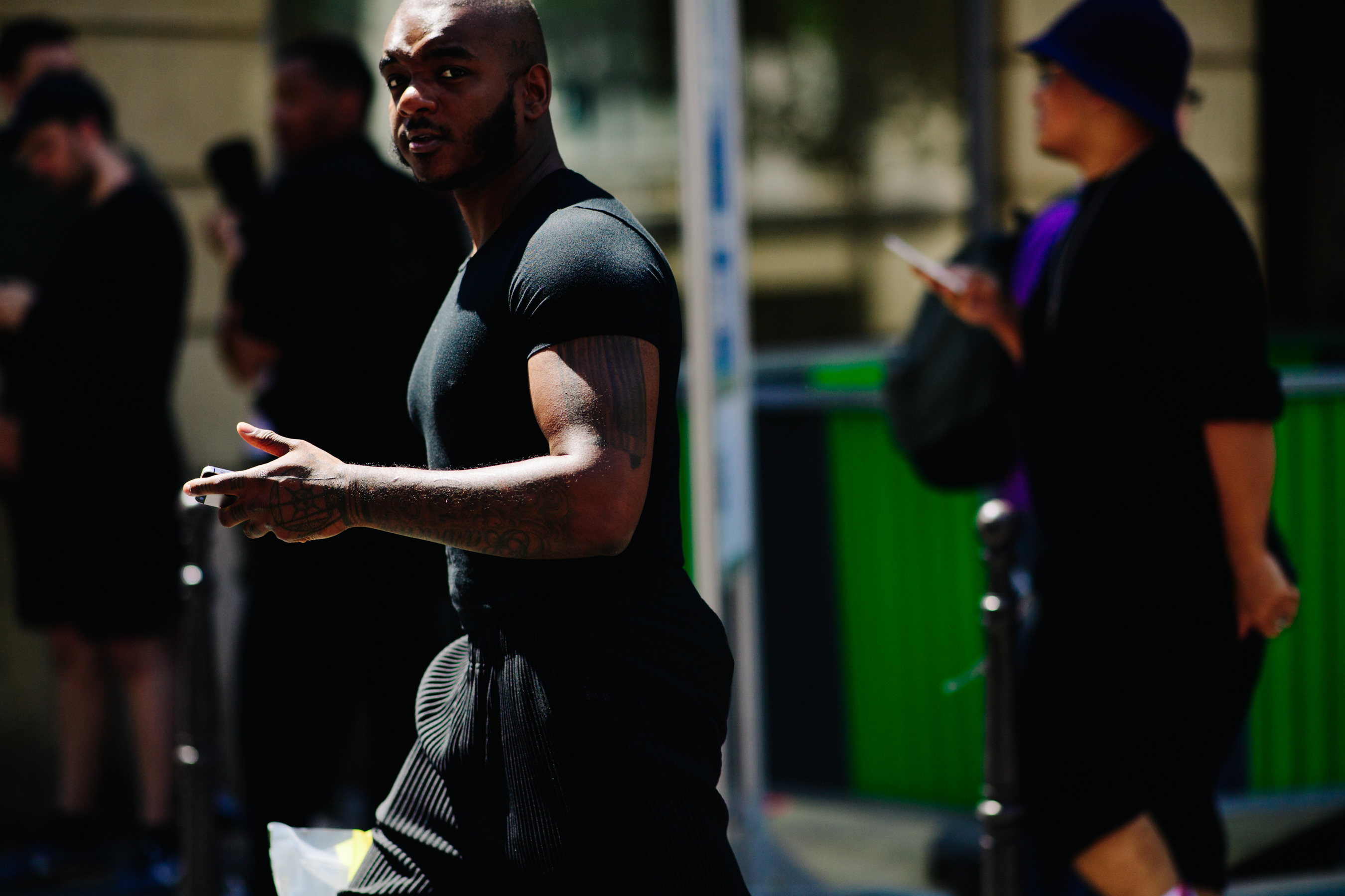 Man wearing a tight black t-shirt