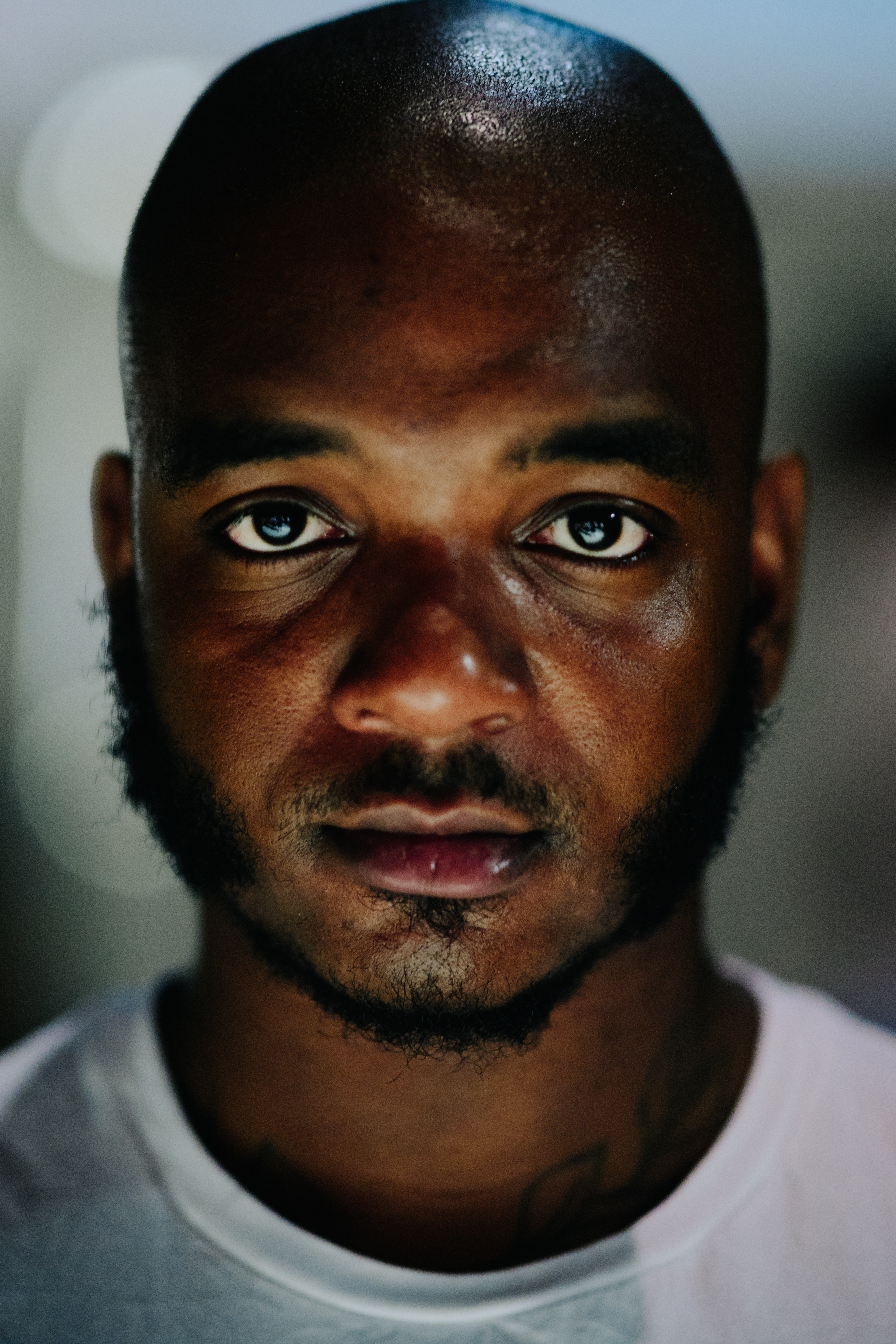 Portrait of a man with neck tattoos