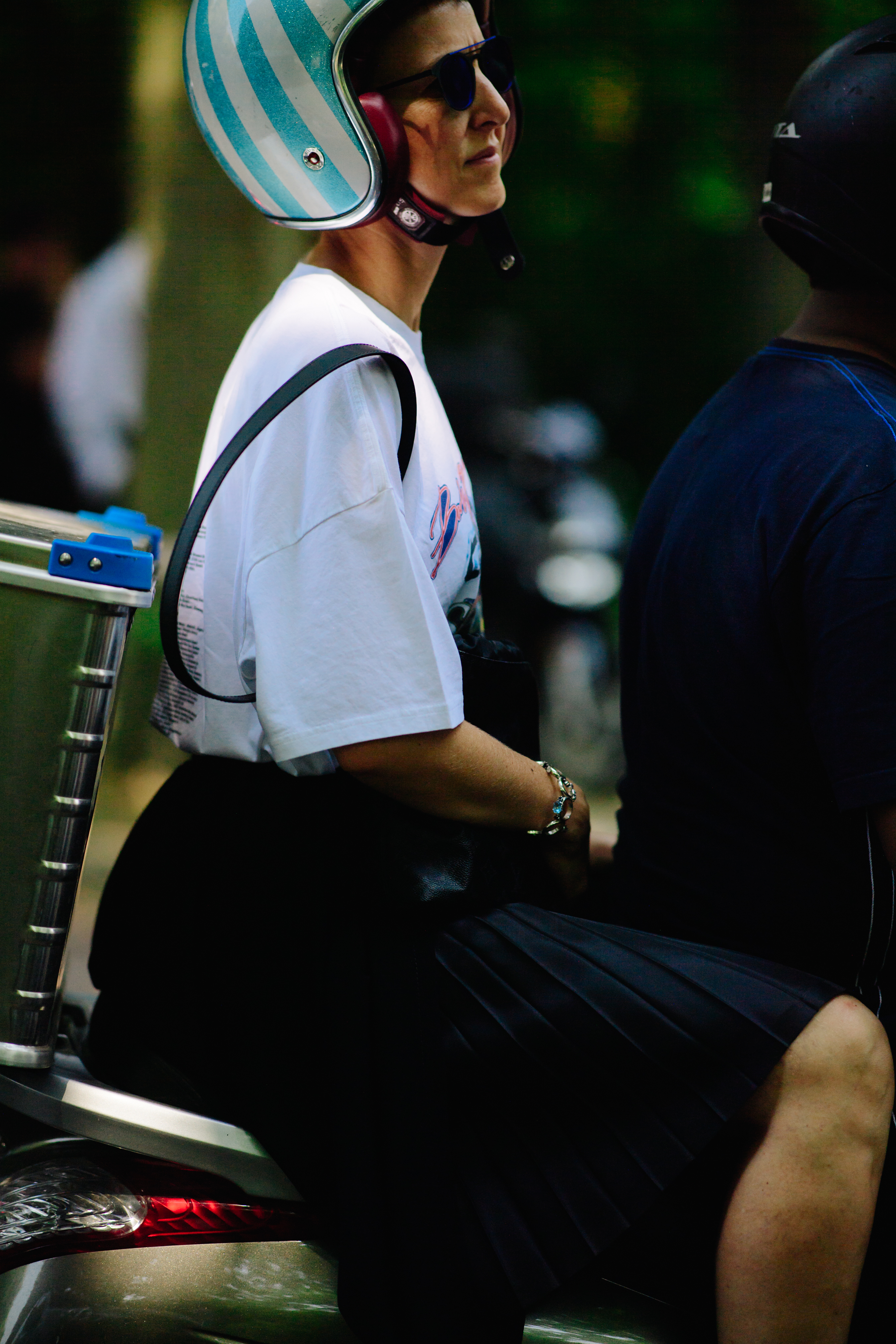 Woman wearing a striped helmet