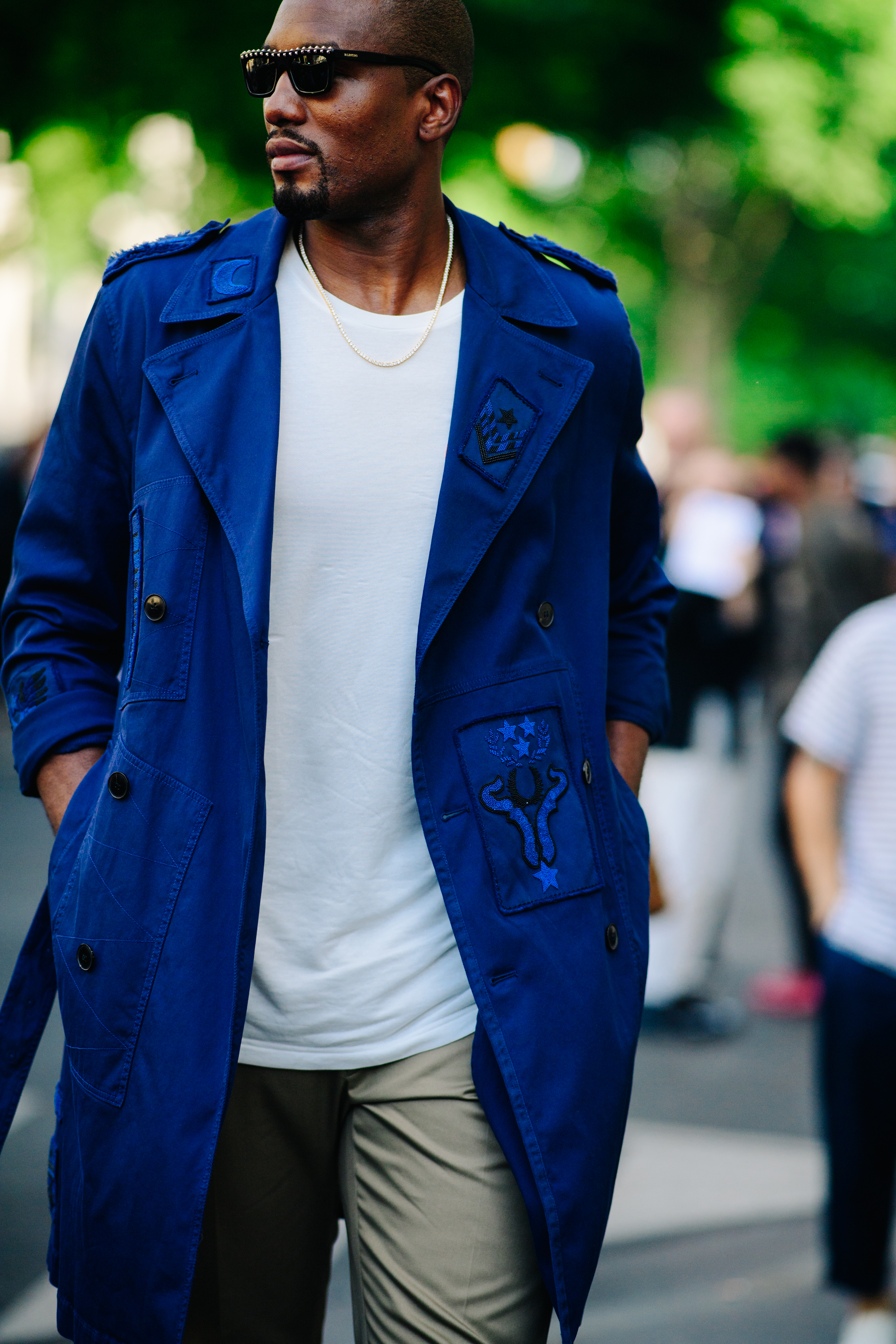 Man wearing a long blue coat