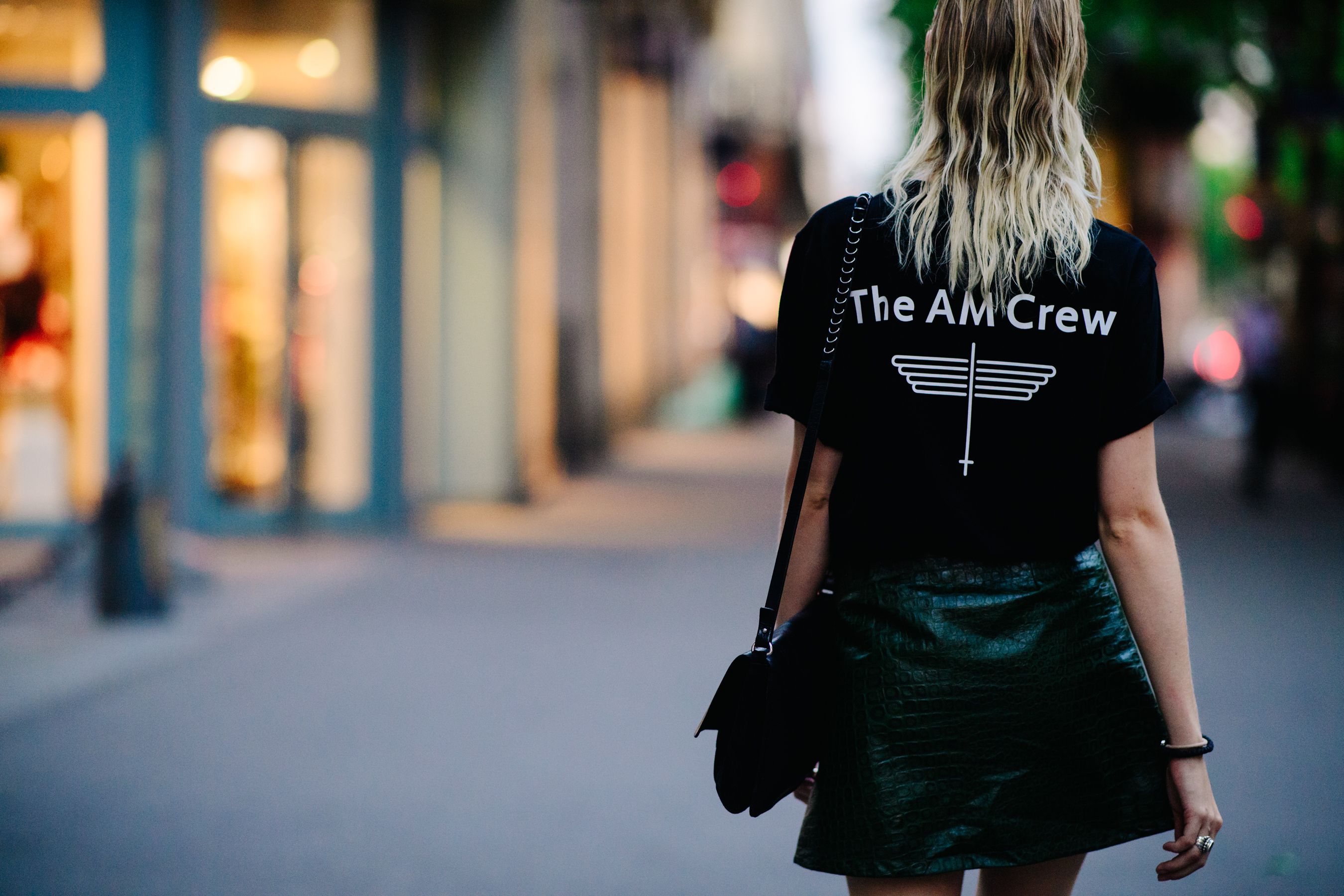 Woman wearing an The AM Crew t-shirt
