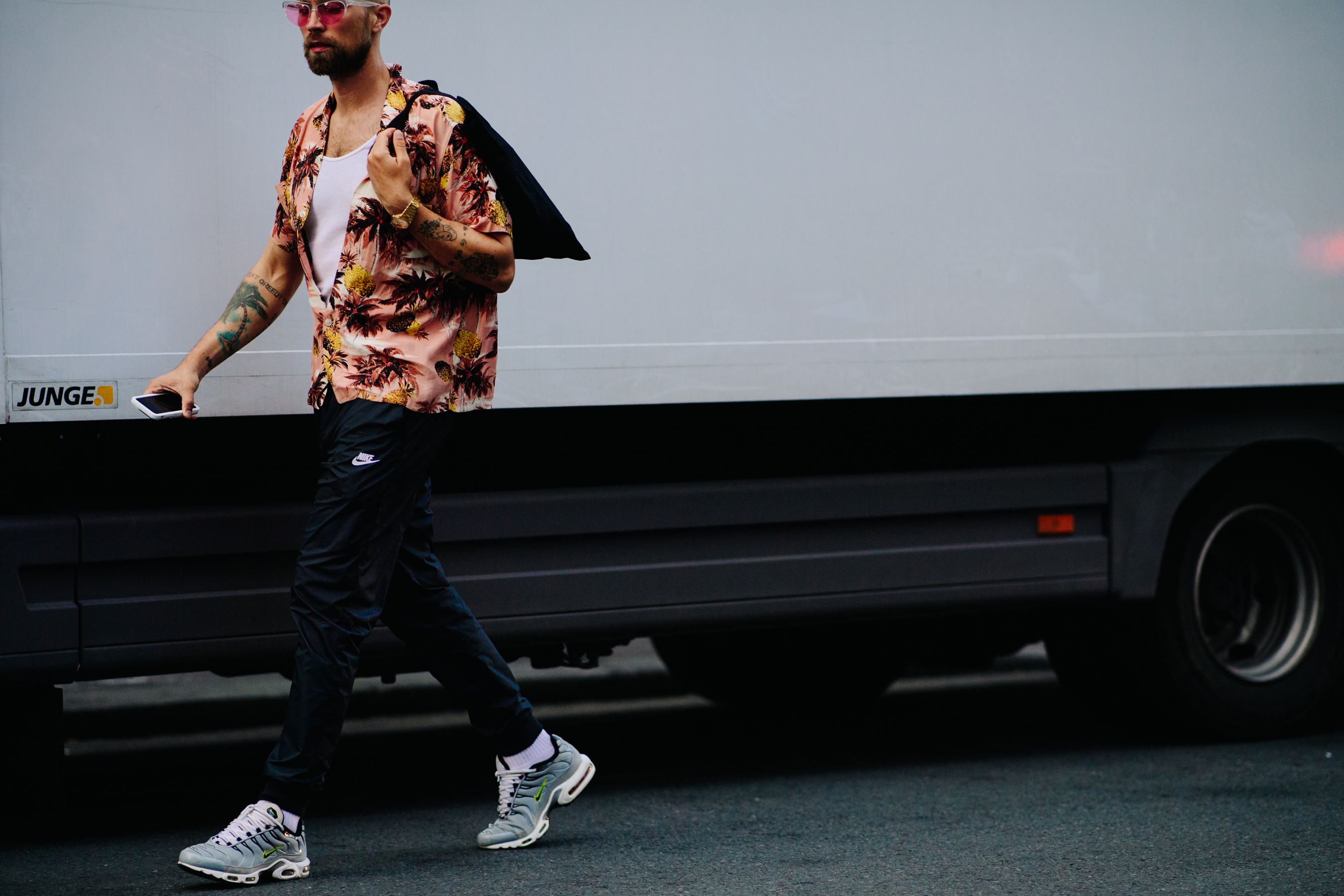 Man wearing Nike trousers and sneakers