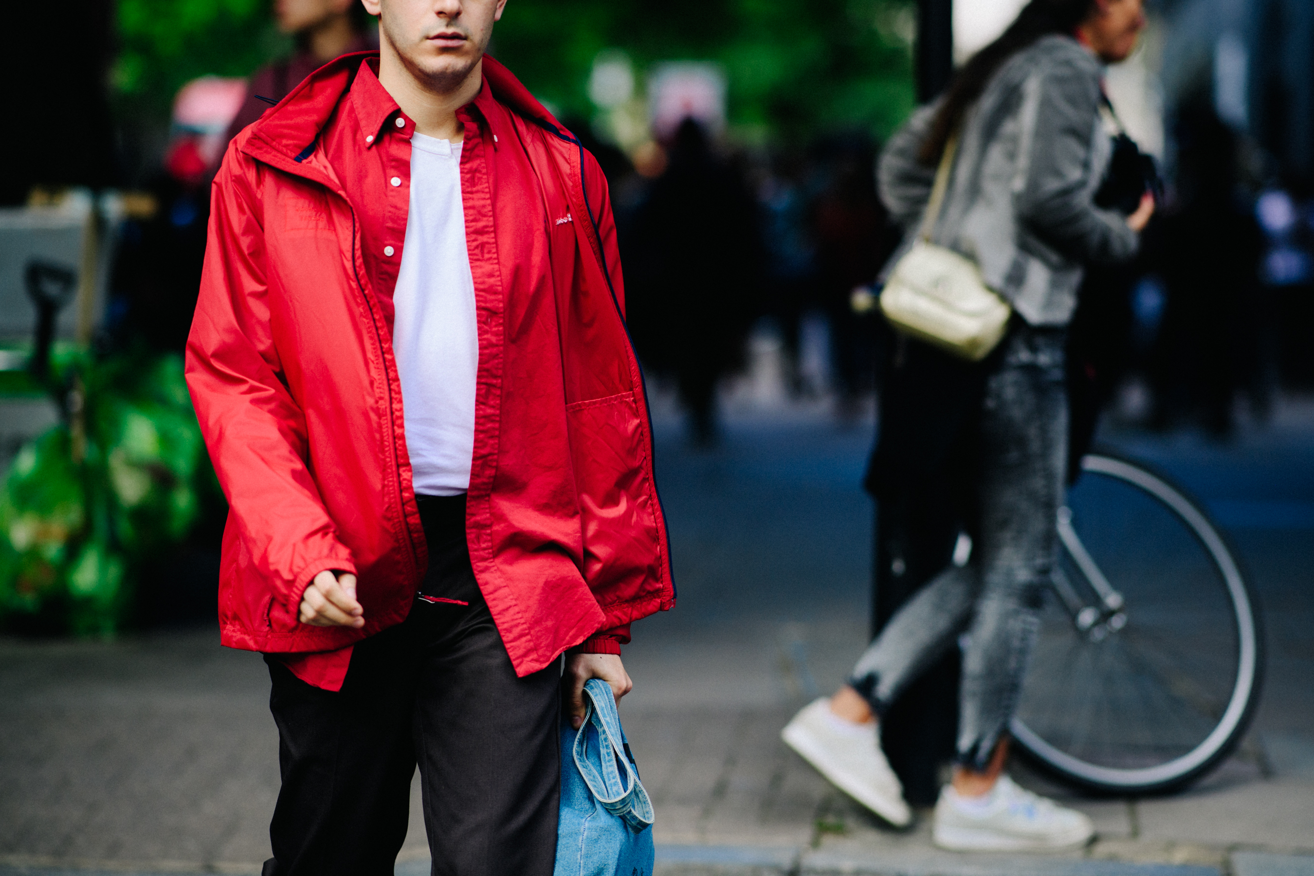 Man wearing red wind breaker
