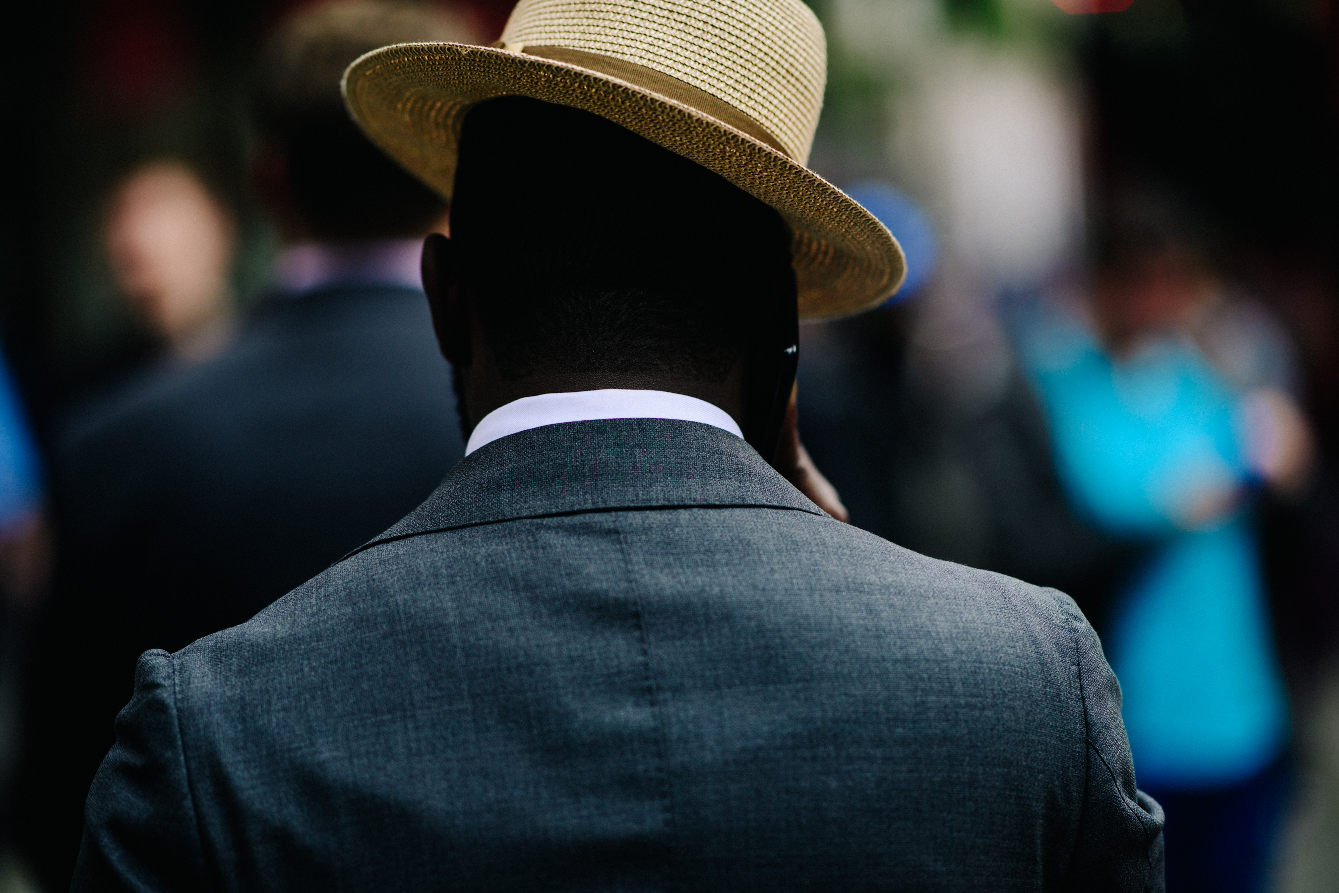 Man wearing suit and hat