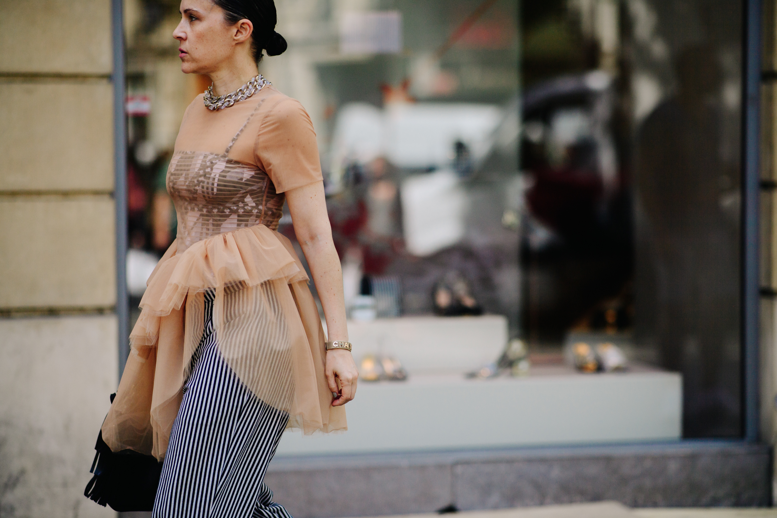 Woman wearing a Chanel bracelet