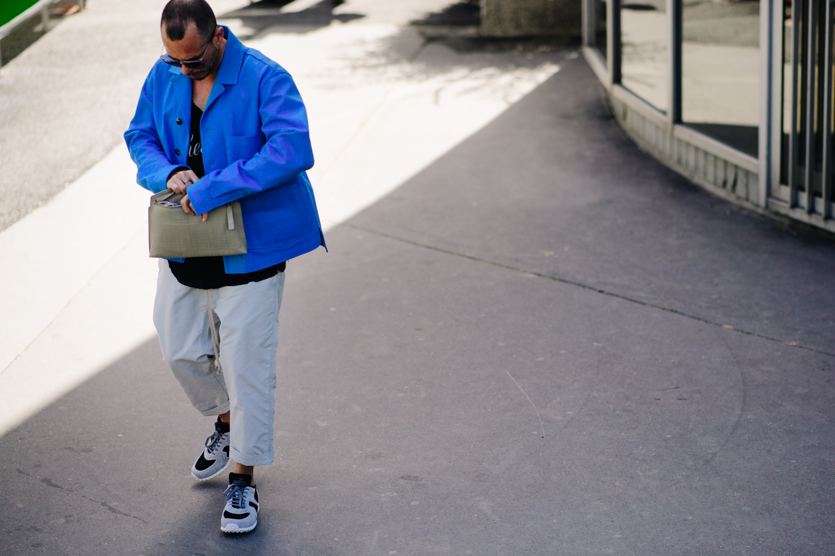 Man wearing grey Valentino sneakers