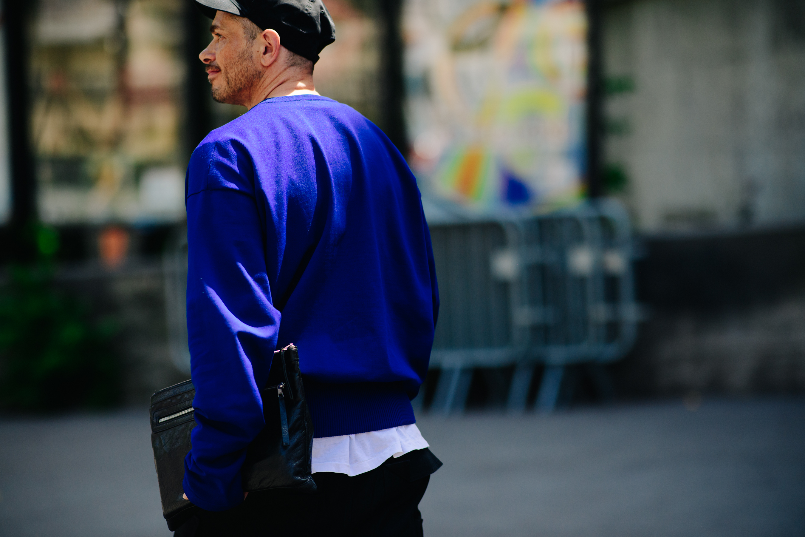 Man wearing a bright blue sweater