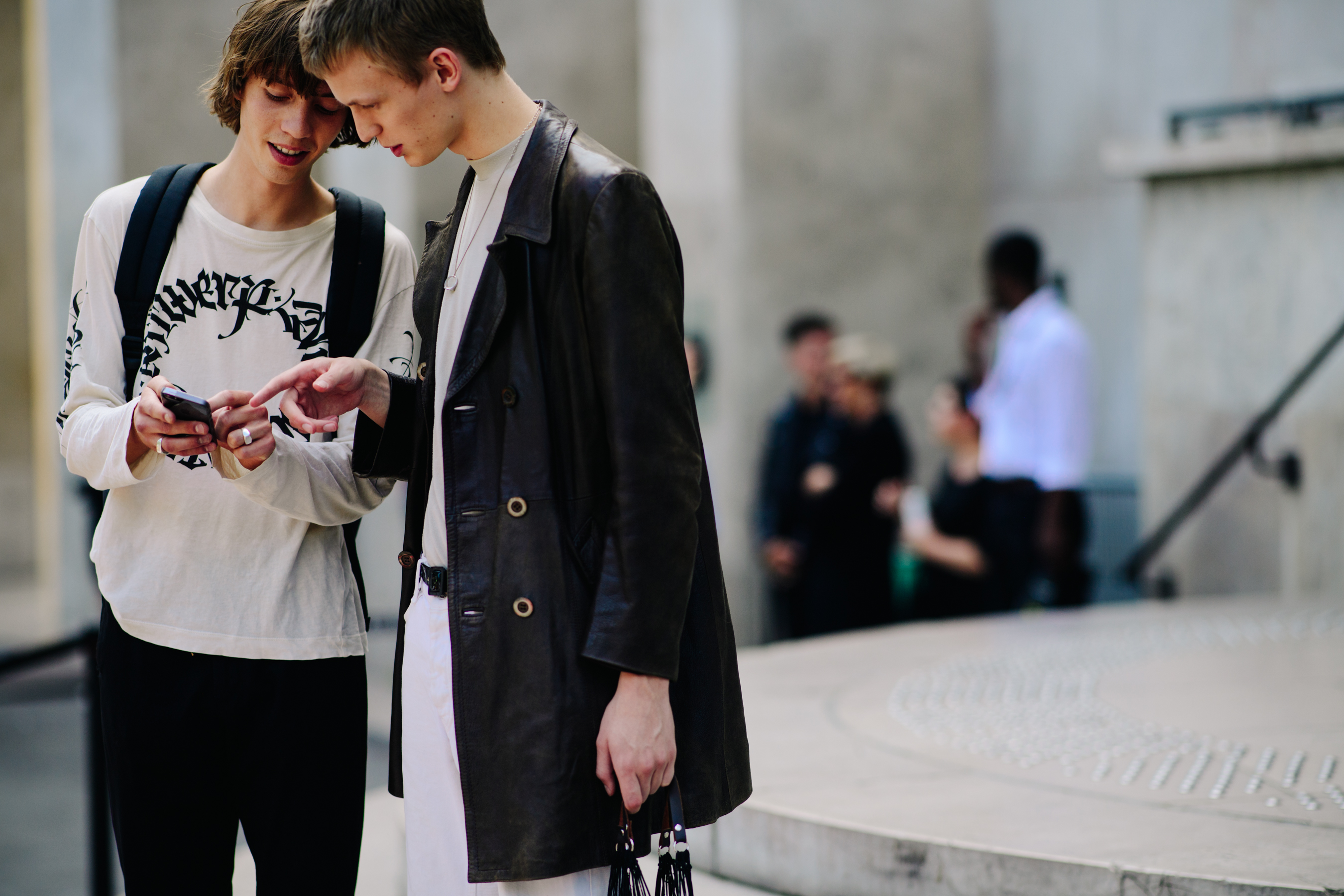 Two models chatting on the street