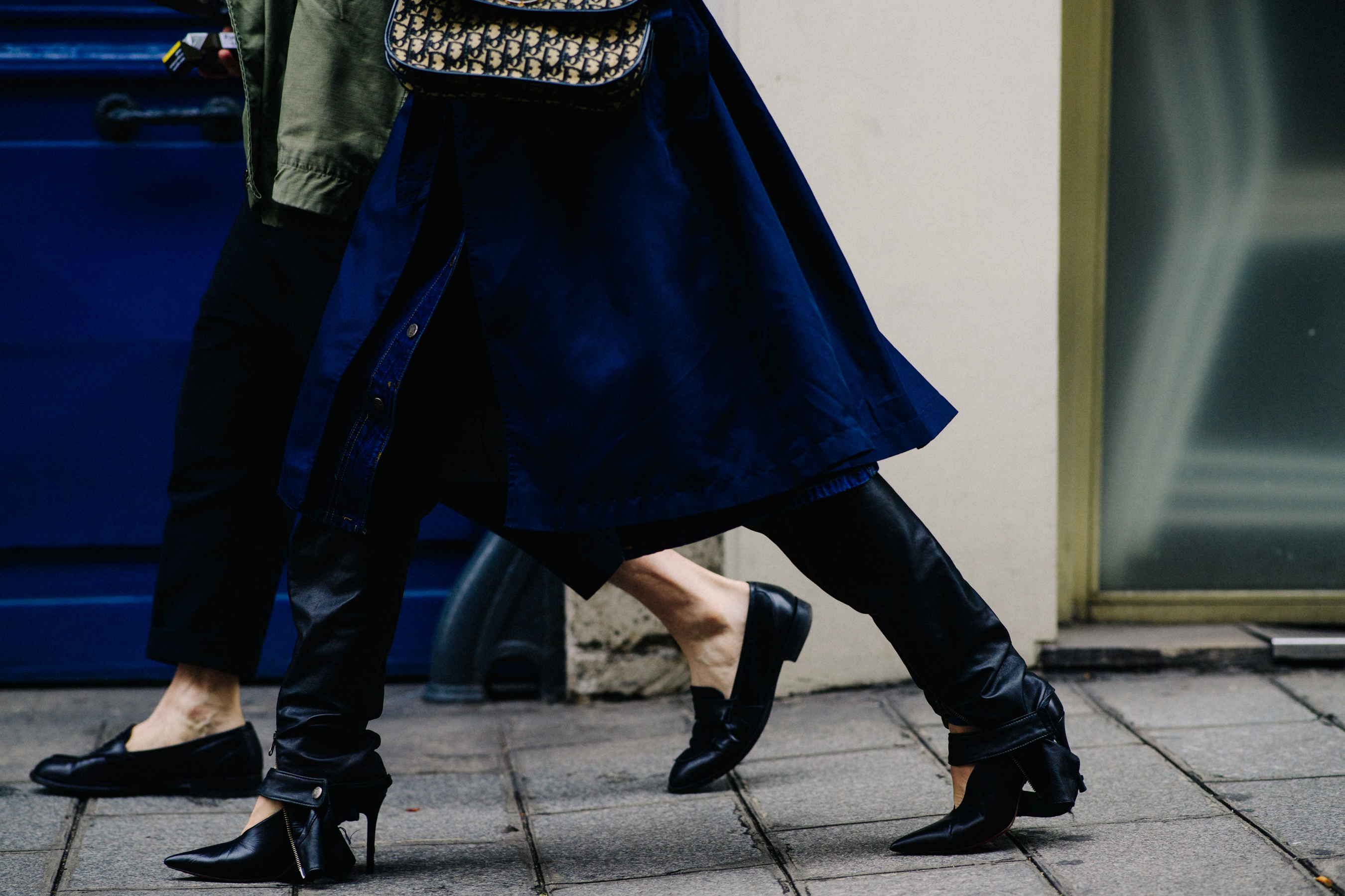 Woman wearing leather pants and stilettos