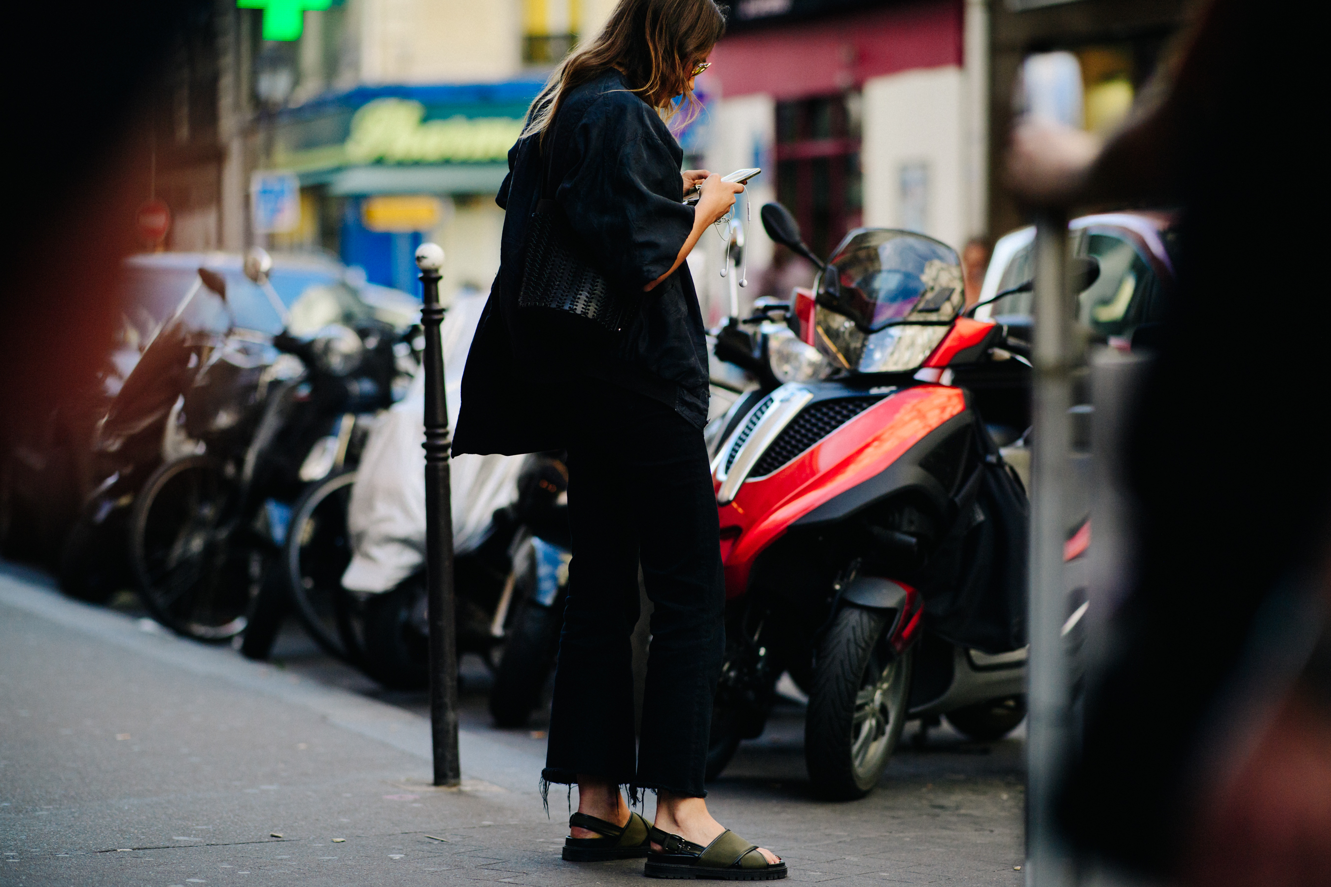 Woman wearing dark green sandals