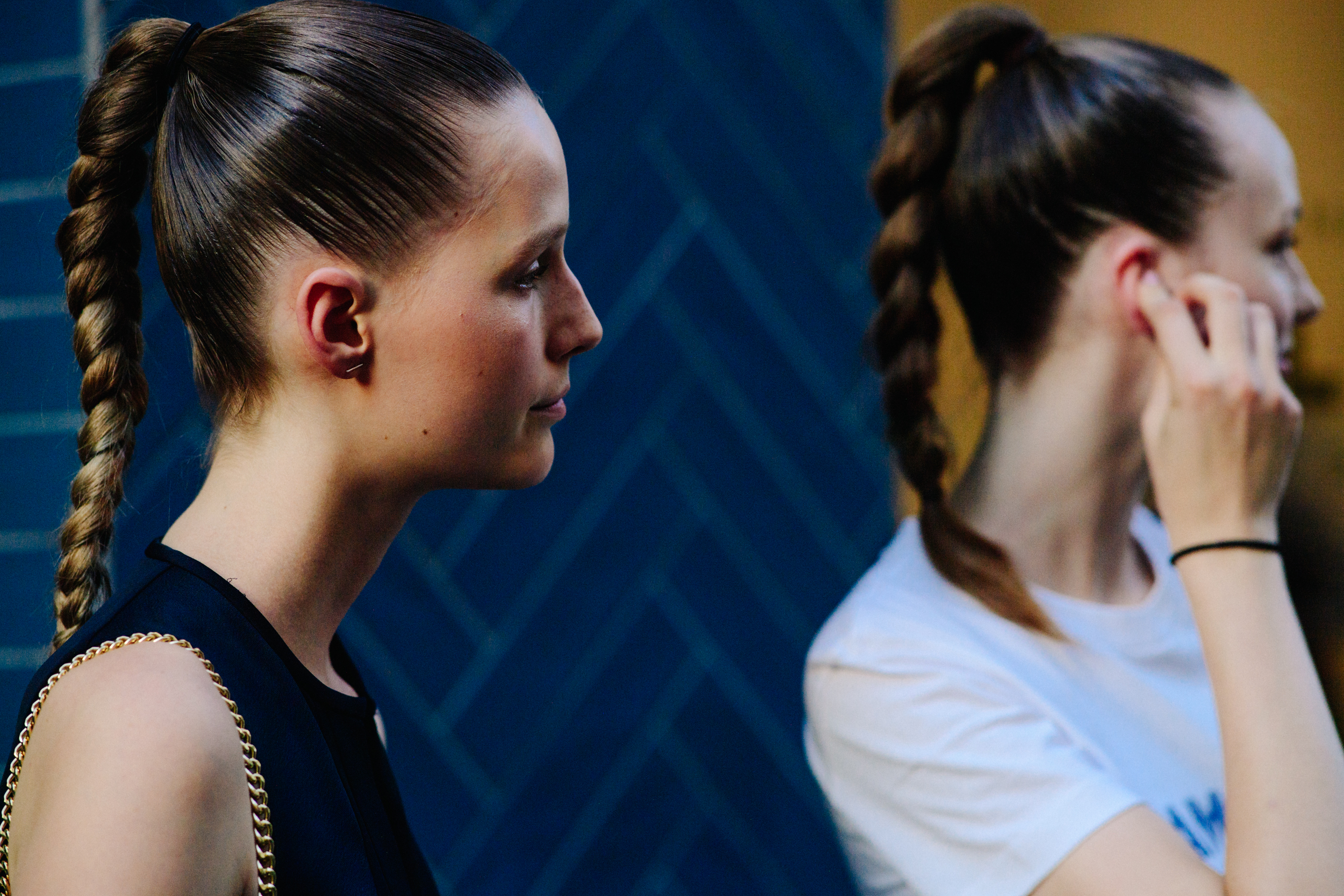 Two models with pony tails
