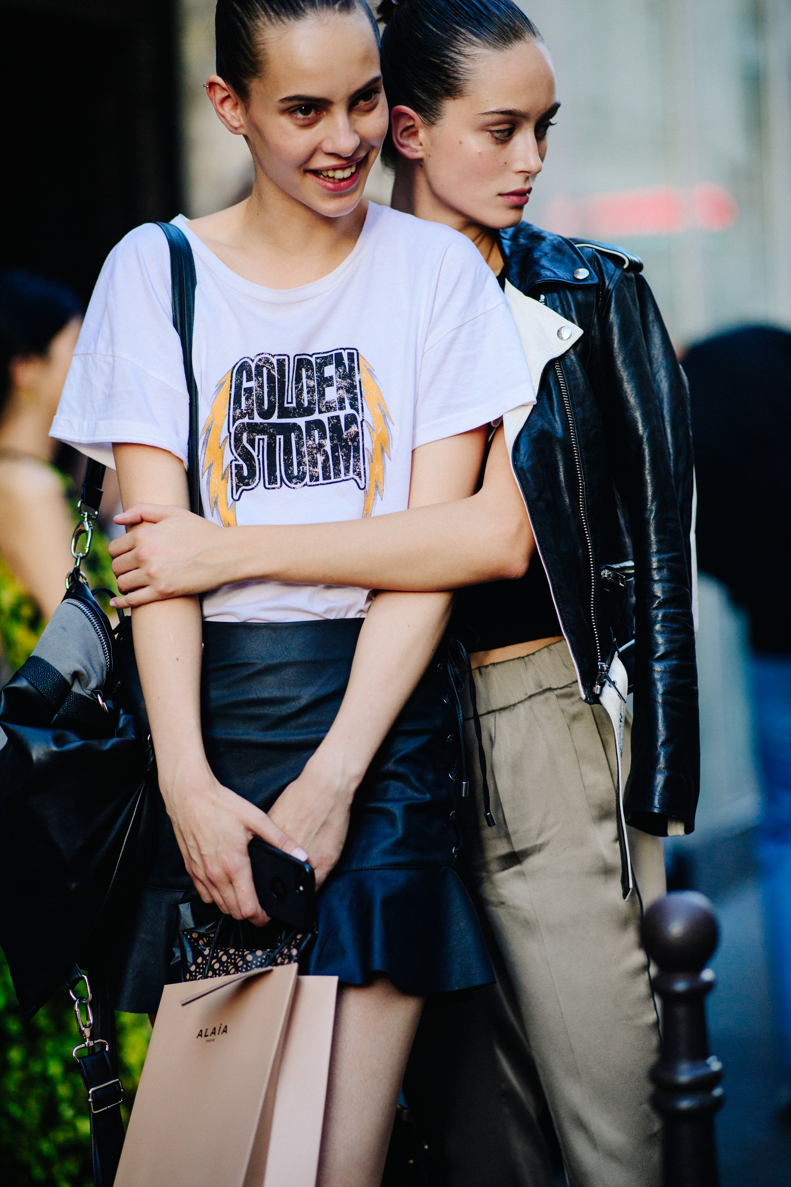 Two models posing after a show