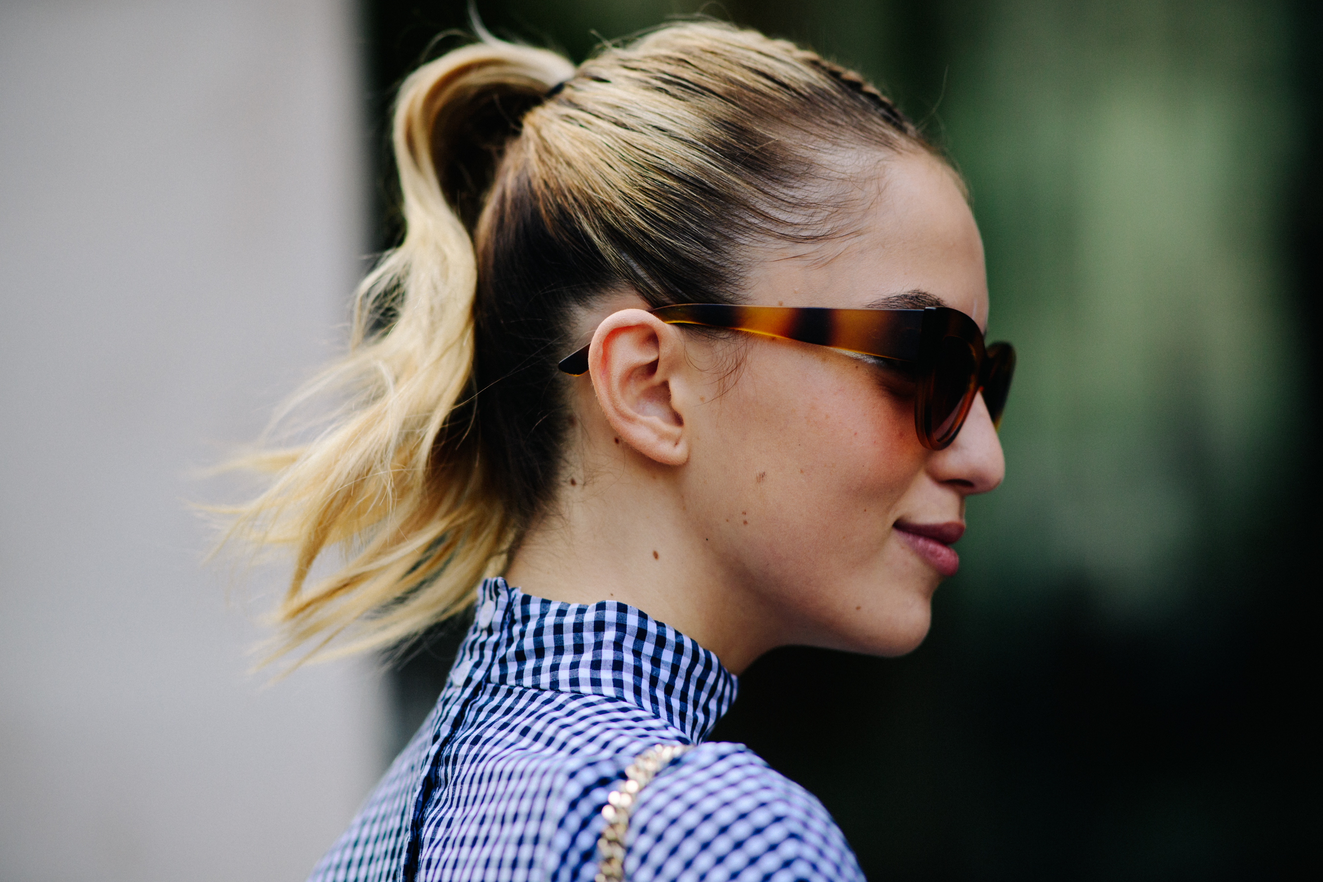 Female model wearing tortoise sunglasses