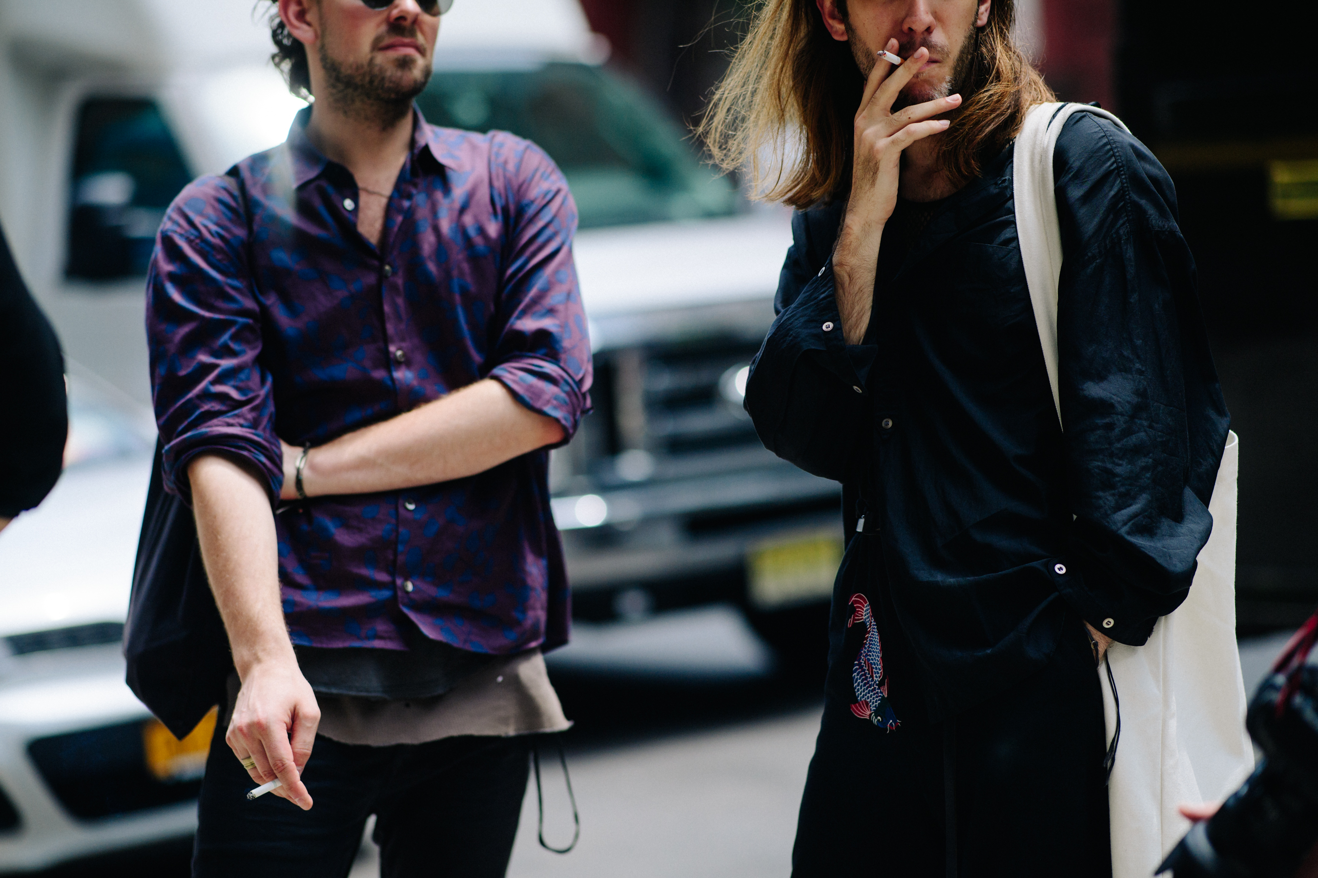 Two men in shirts smoking